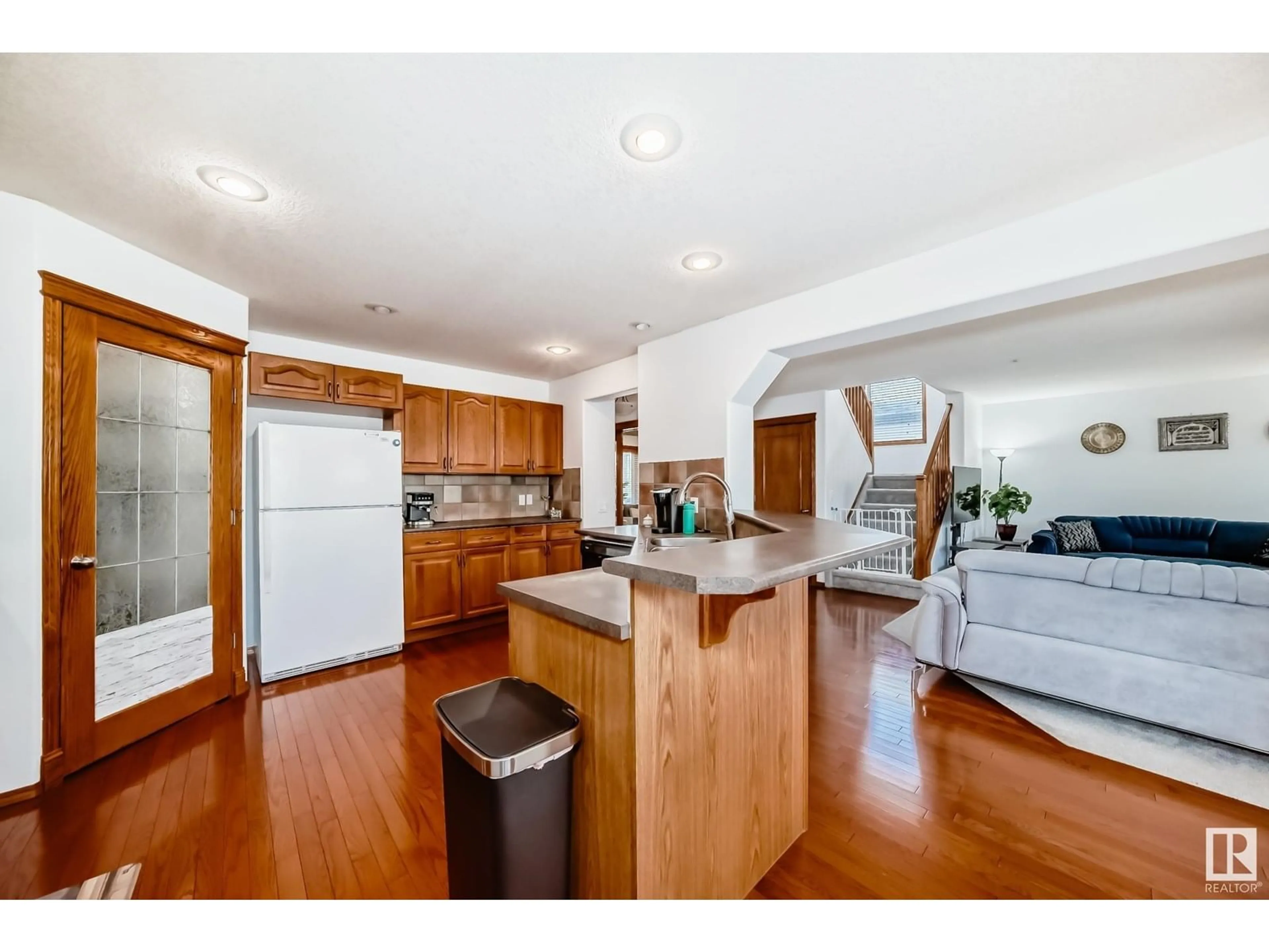 Open concept kitchen, wood/laminate floor for 13416 159 AV, Edmonton Alberta T6V1S4