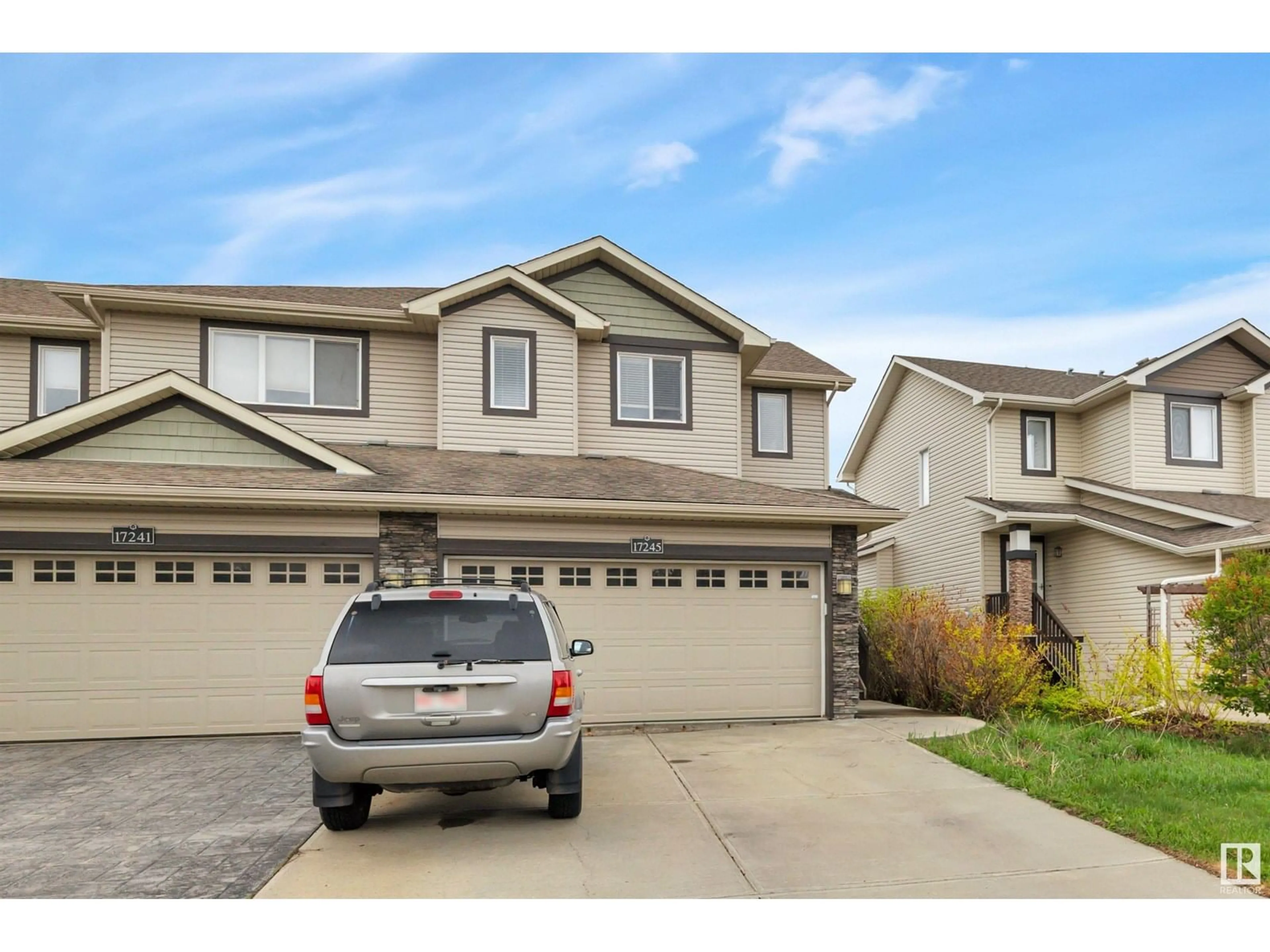 Home with vinyl exterior material, street for 17245 8A AV SW, Edmonton Alberta T6W0M7