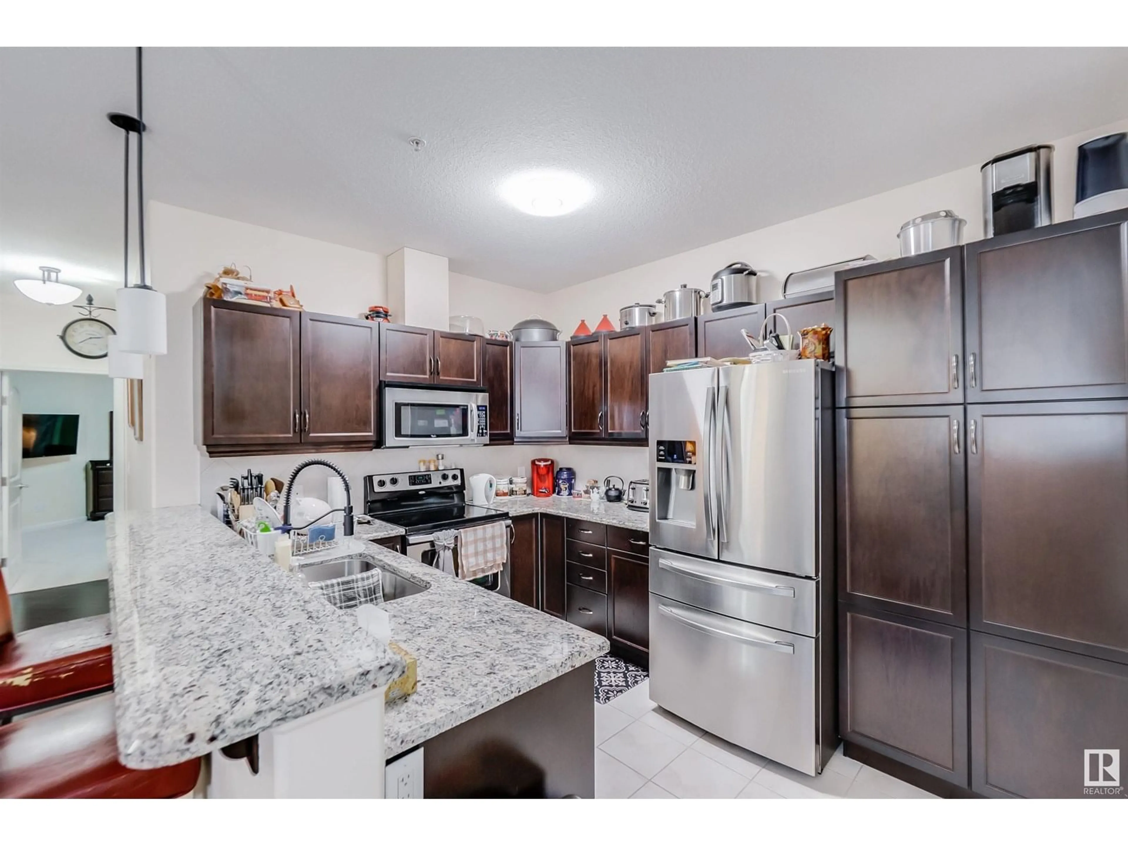 Open concept kitchen, ceramic/tile floor for #322 - 6083 MAYNARD WY, Edmonton Alberta T6R0S5