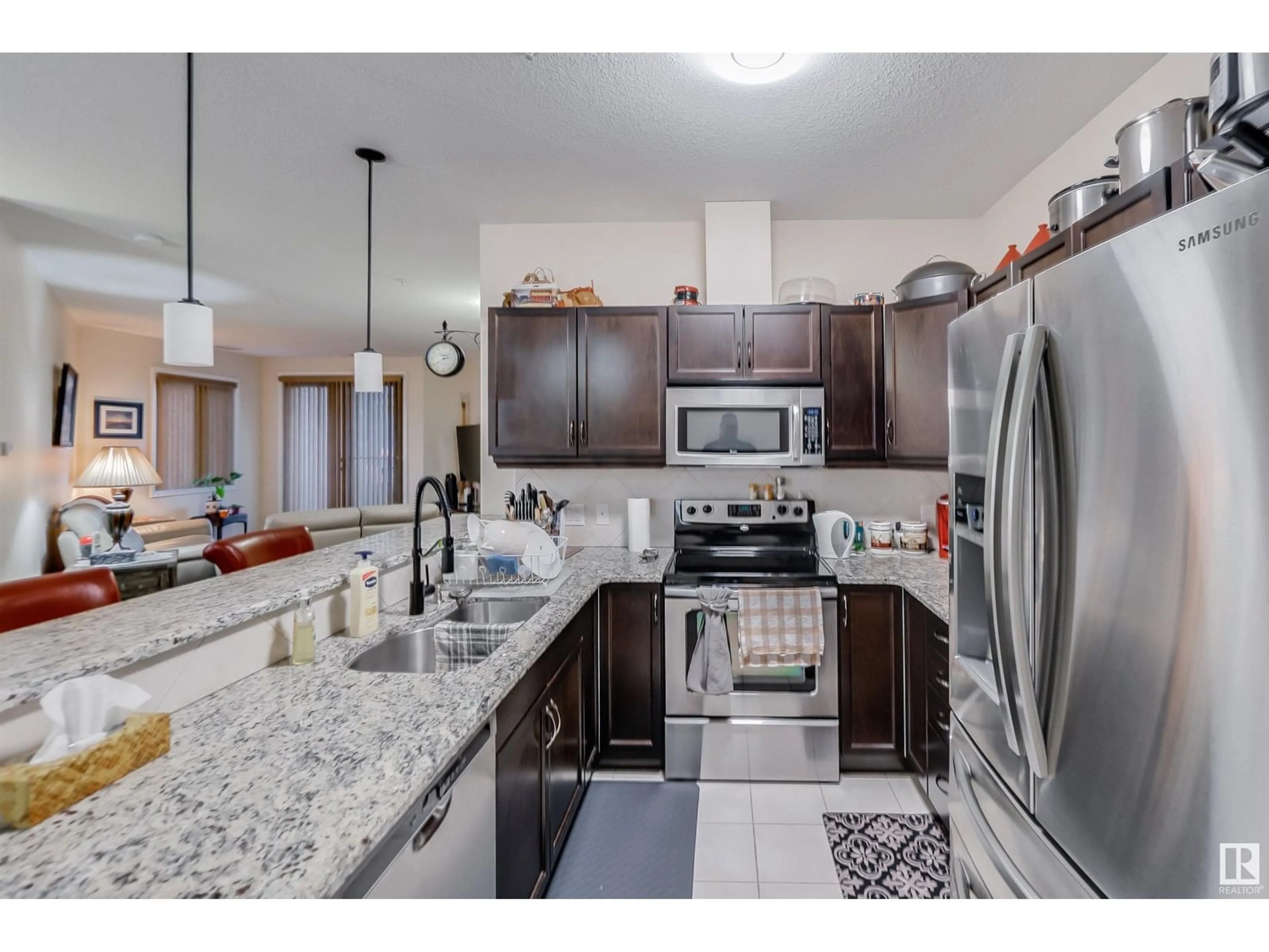 Open concept kitchen, ceramic/tile floor for #322 - 6083 MAYNARD WY, Edmonton Alberta T6R0S5