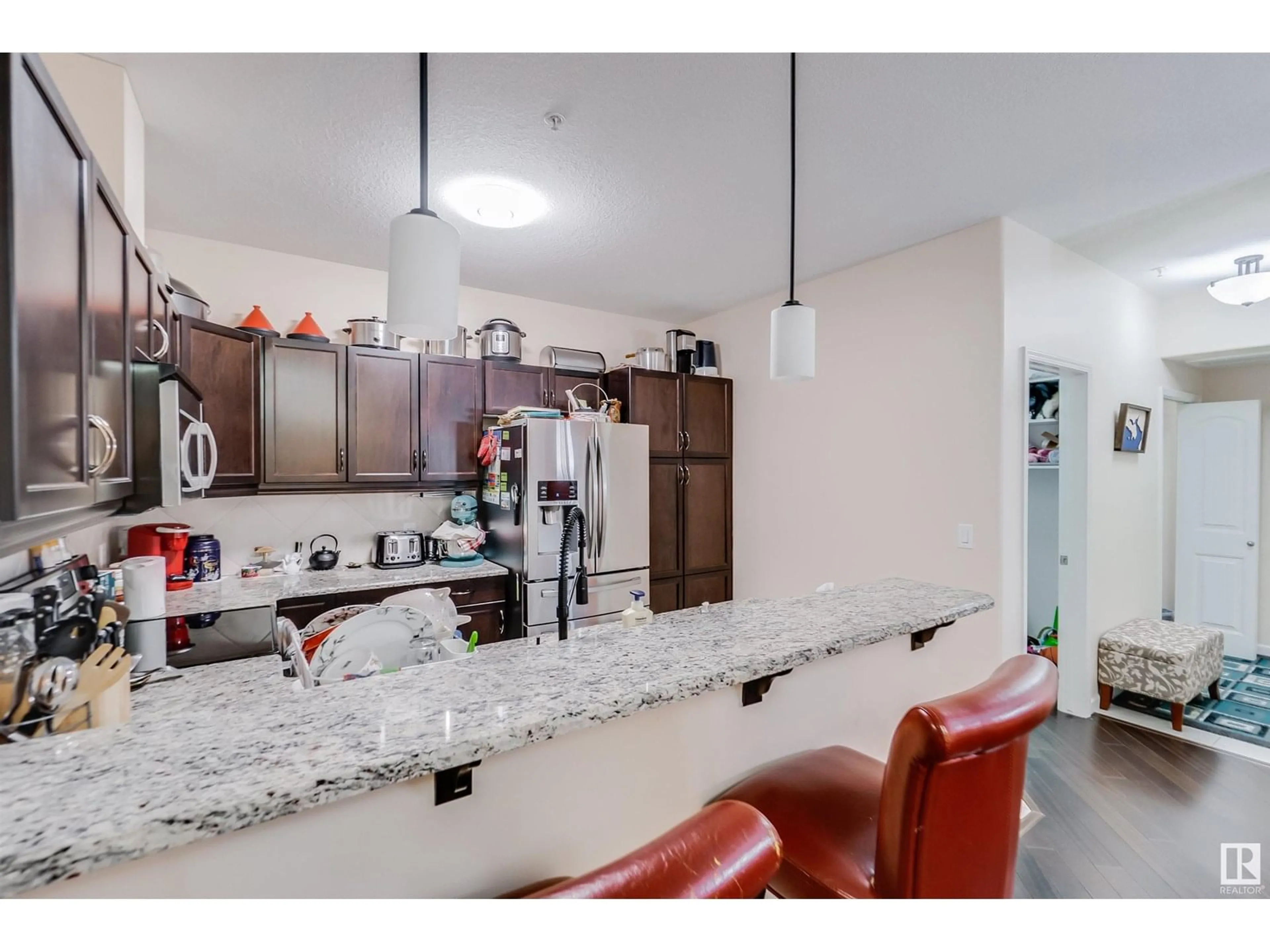 Open concept kitchen, ceramic/tile floor for #322 - 6083 MAYNARD WY, Edmonton Alberta T6R0S5