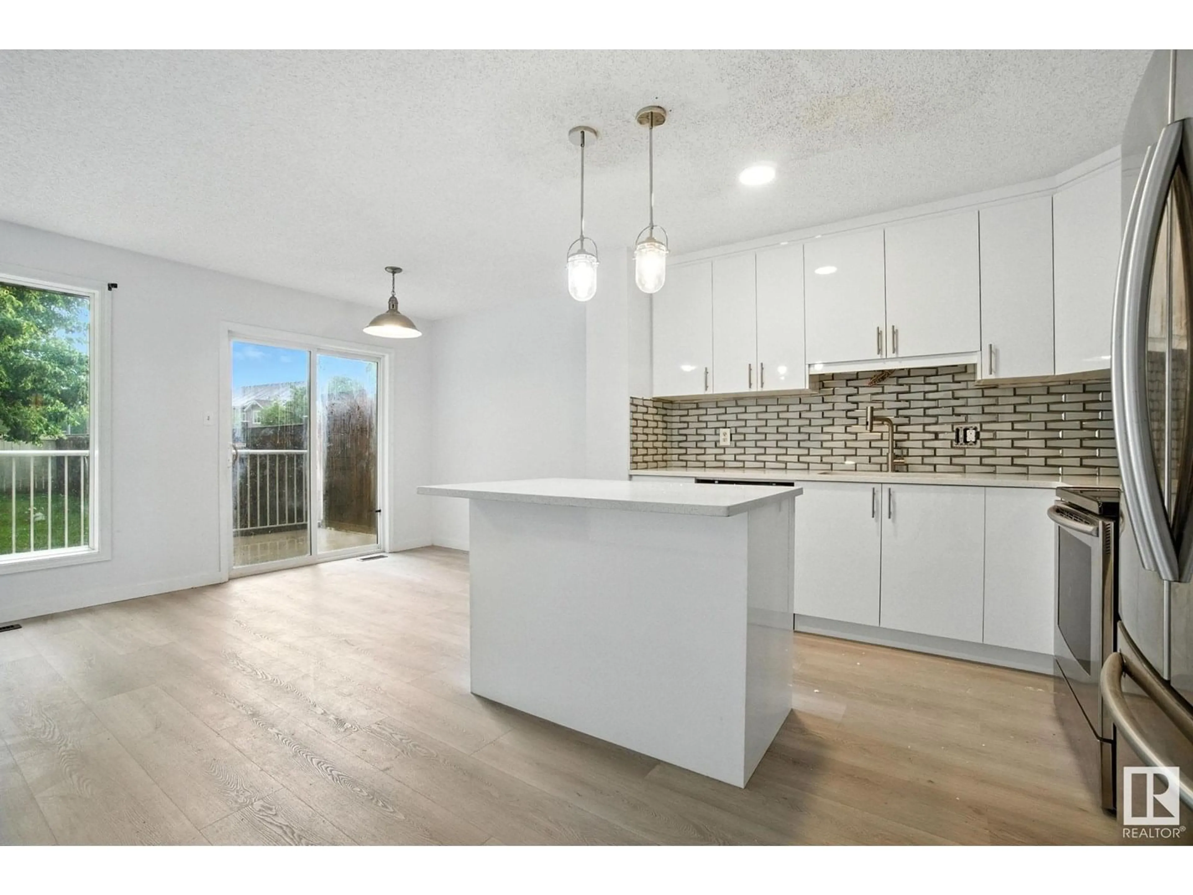 Open concept kitchen, unknown for 7931 7 AV, Edmonton Alberta T6X1N3