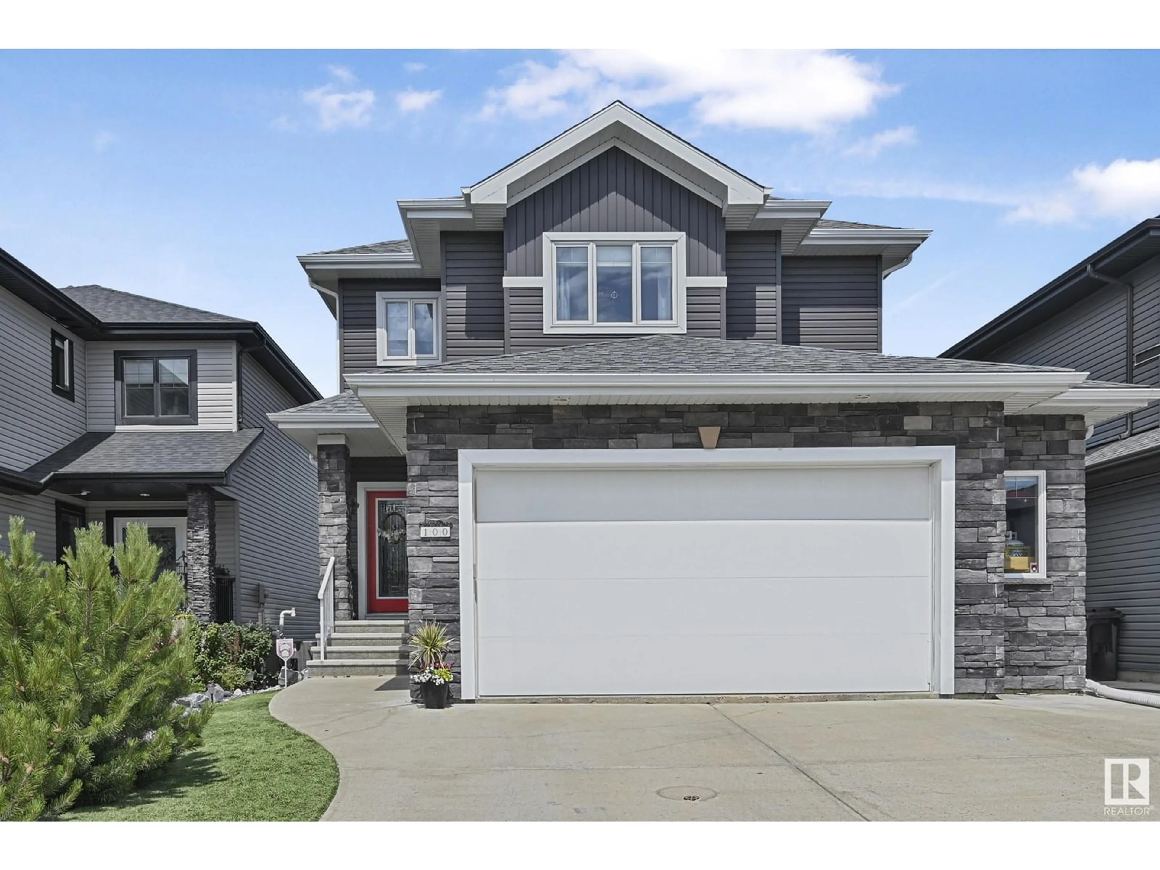 Home with vinyl exterior material, street for 100 ELLISON, Fort Saskatchewan Alberta T8L0M9