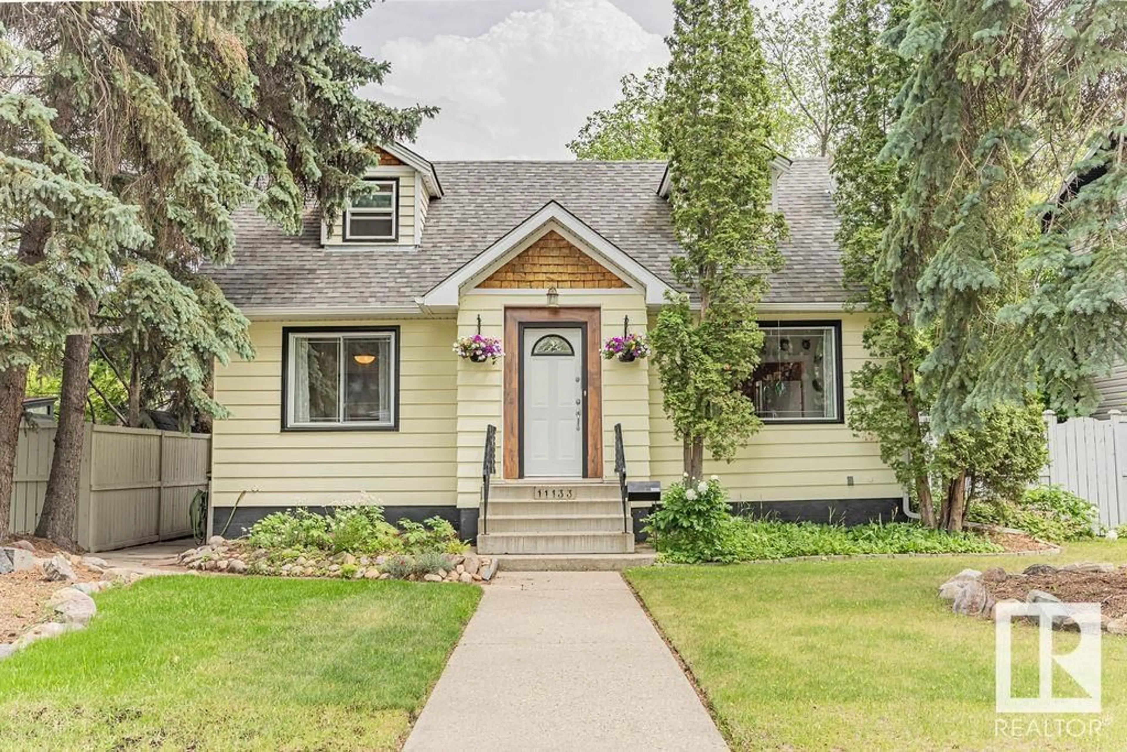 Home with vinyl exterior material, street for 11133 57 ST, Edmonton Alberta T5W3T7