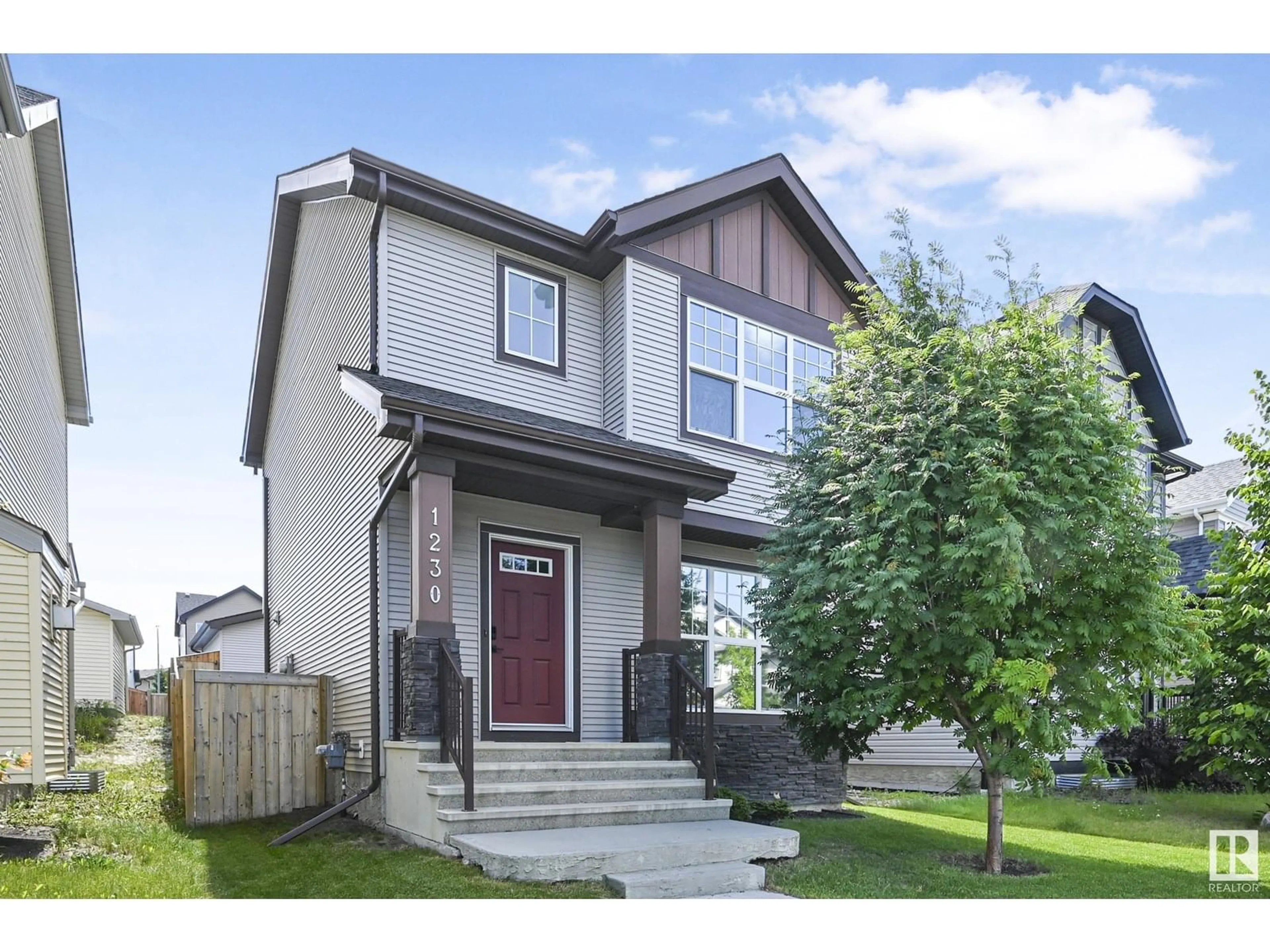 Home with vinyl exterior material, street for 1230 MCCONACHIE BV, Edmonton Alberta T5Y3T1