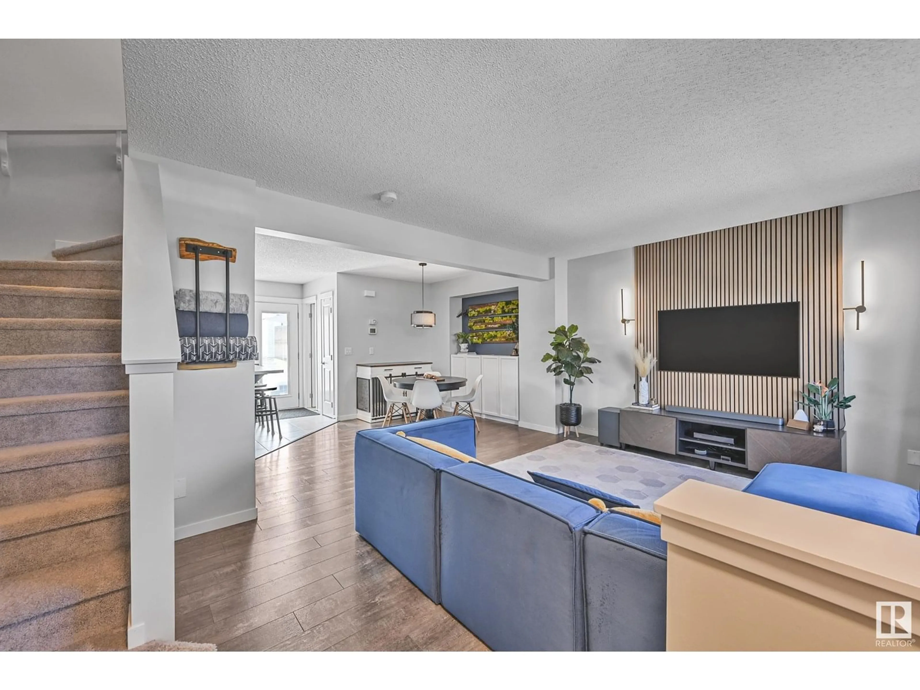 Living room with furniture, wood/laminate floor for 1230 MCCONACHIE BV, Edmonton Alberta T5Y3T1