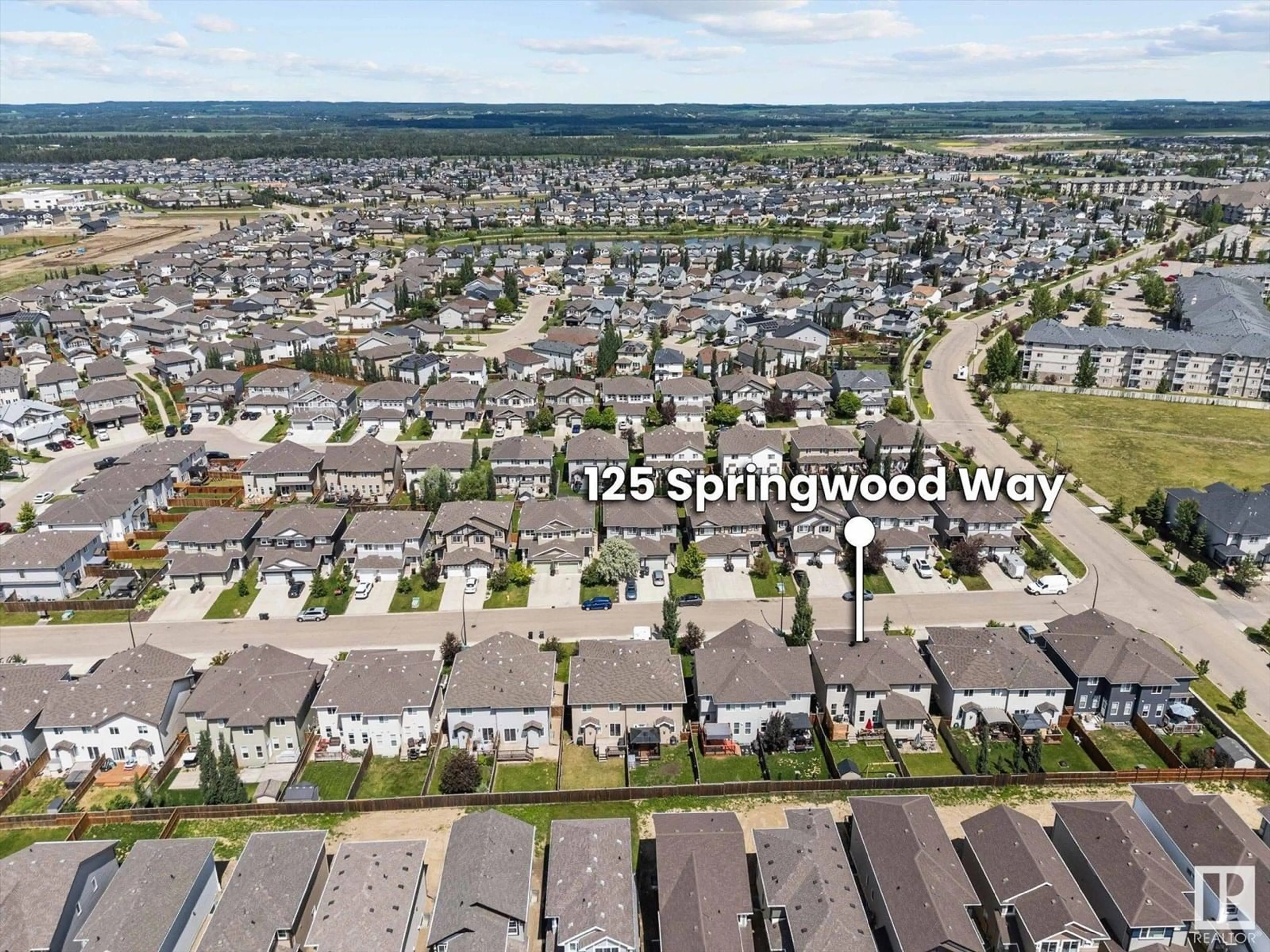 A pic from outside/outdoor area/front of a property/back of a property/a pic from drone, mountain view for 125 SPRINGWOOD WY, Spruce Grove Alberta T7X0S7