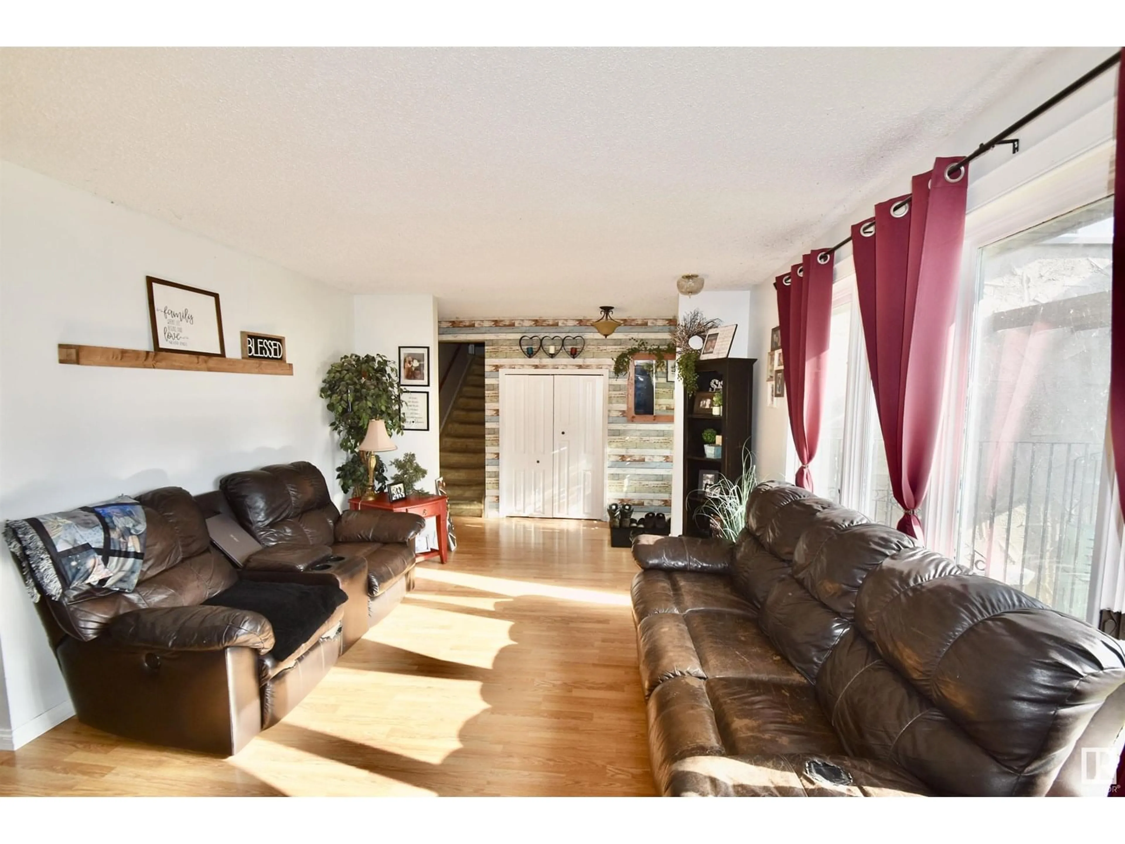 Living room with furniture, wood/laminate floor for 4405 46A ST, St. Paul Town Alberta T0A3A3
