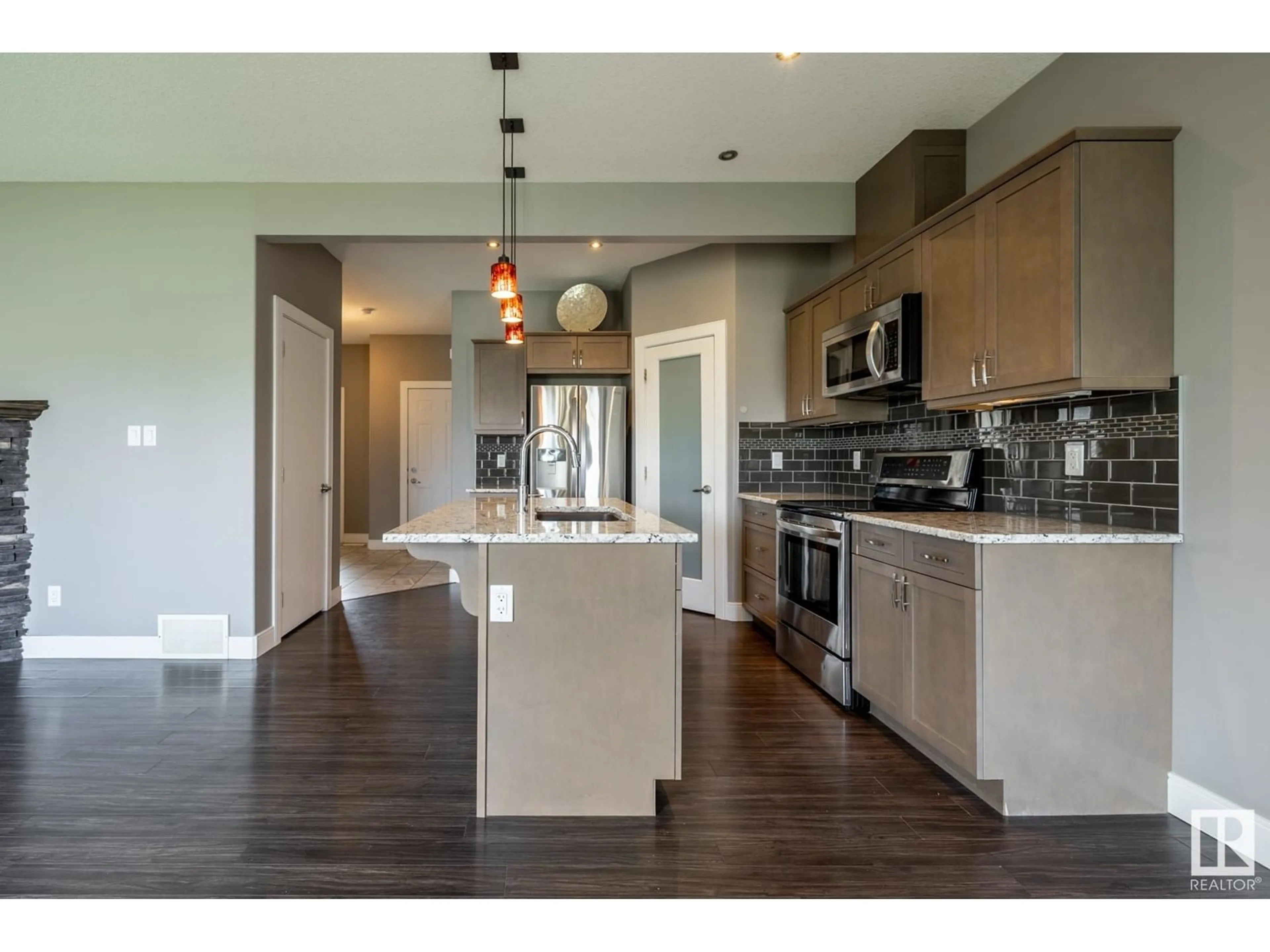 Open concept kitchen, wood/laminate floor for 324 GENESIS VI, Stony Plain Alberta T7Z1A8