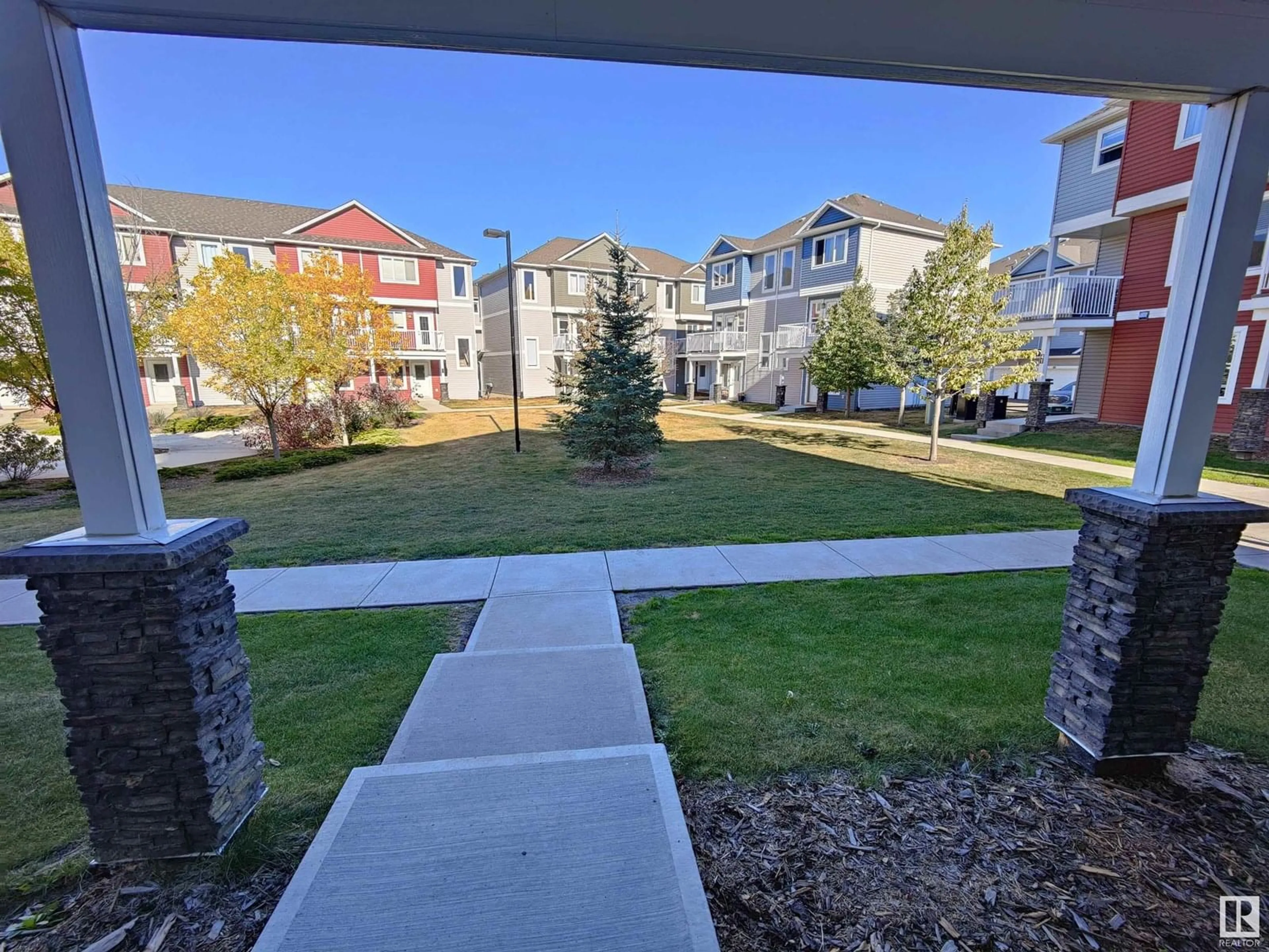 A pic from outside/outdoor area/front of a property/back of a property/a pic from drone, street for #46 - 1816 RUTHERFORD RD, Edmonton Alberta T6W2K6