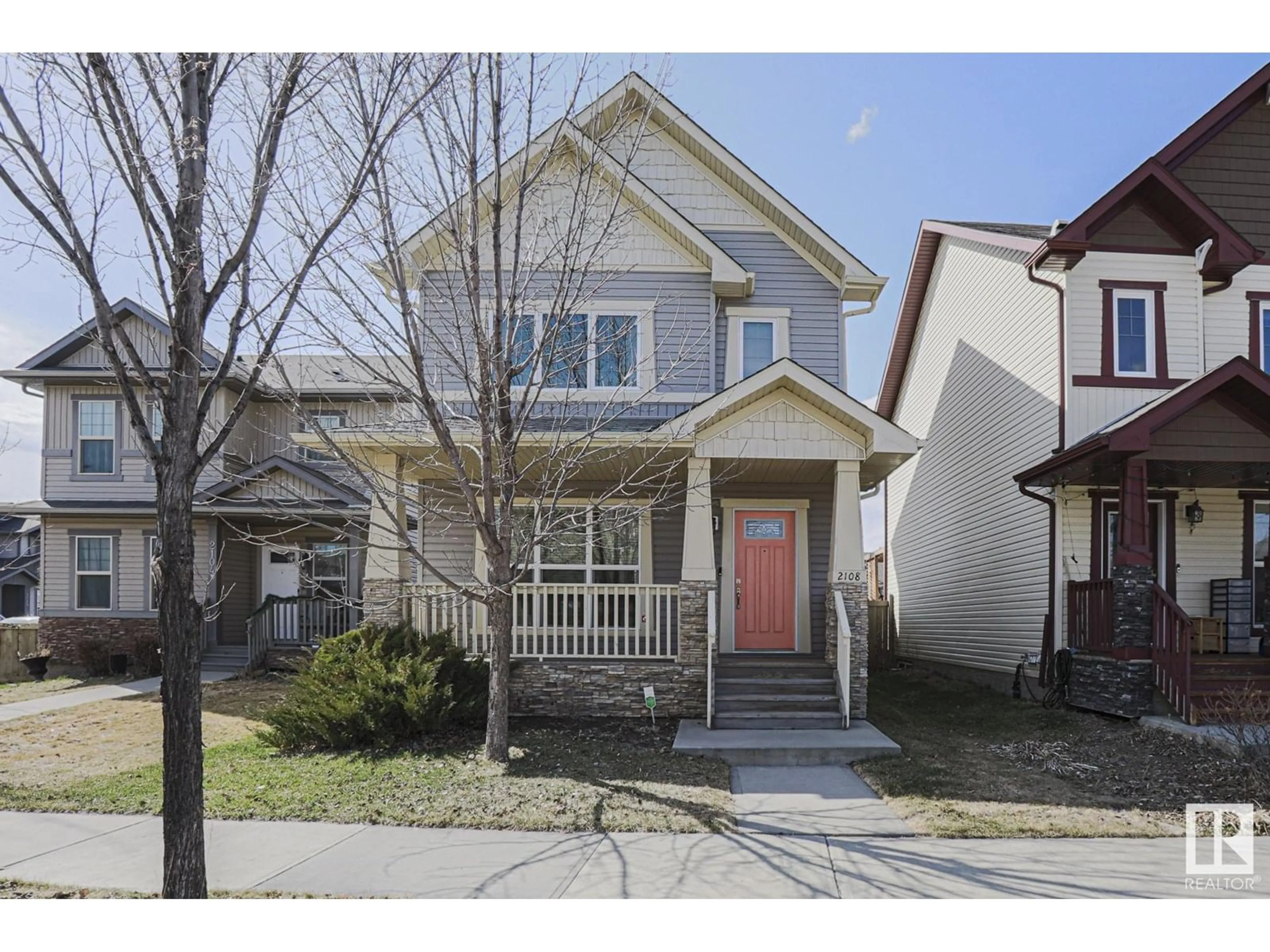 Home with vinyl exterior material, street for 2108 30 ST, Edmonton Alberta T6T0K3
