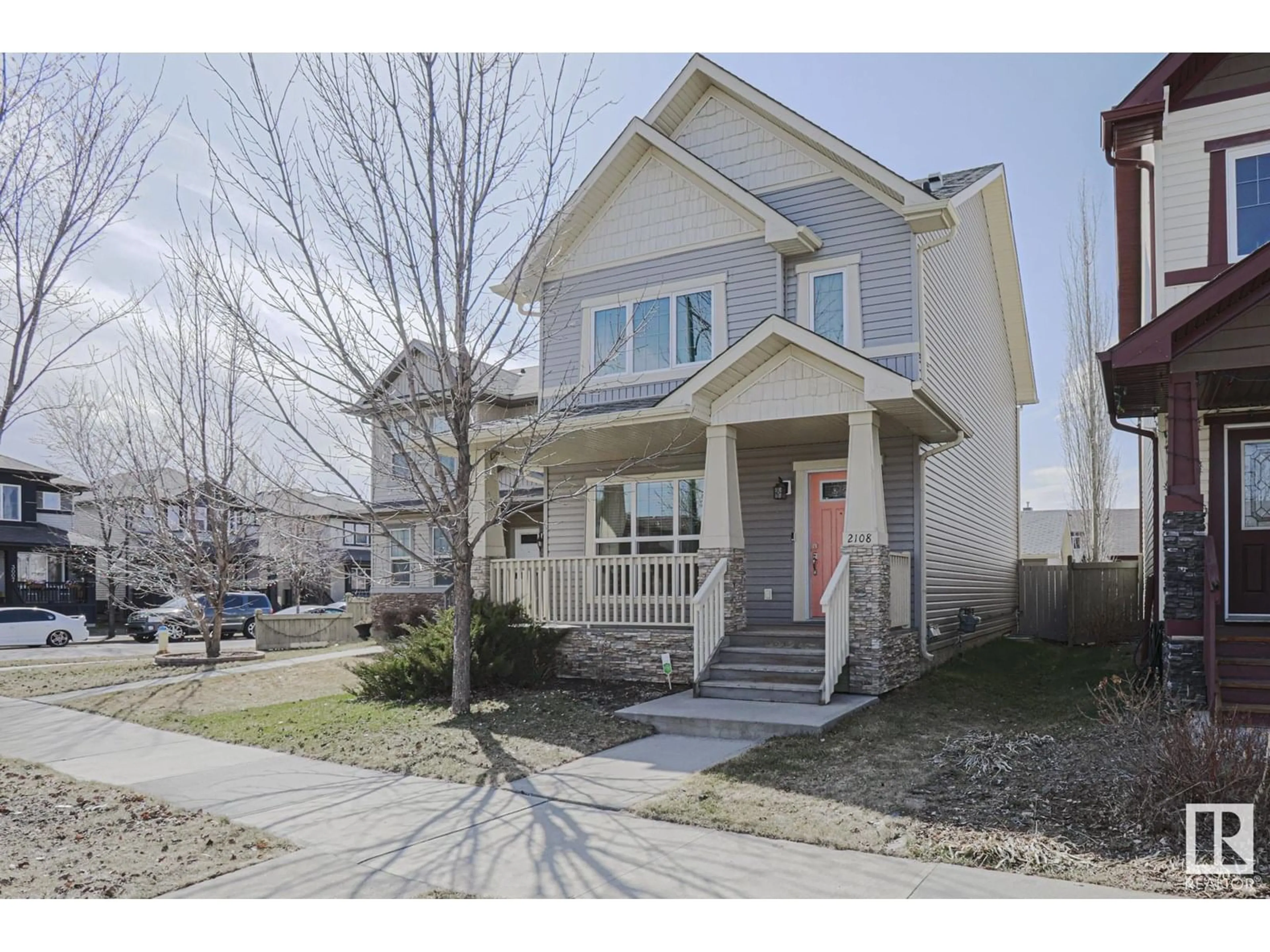 Home with vinyl exterior material, street for 2108 30 ST, Edmonton Alberta T6T0K3