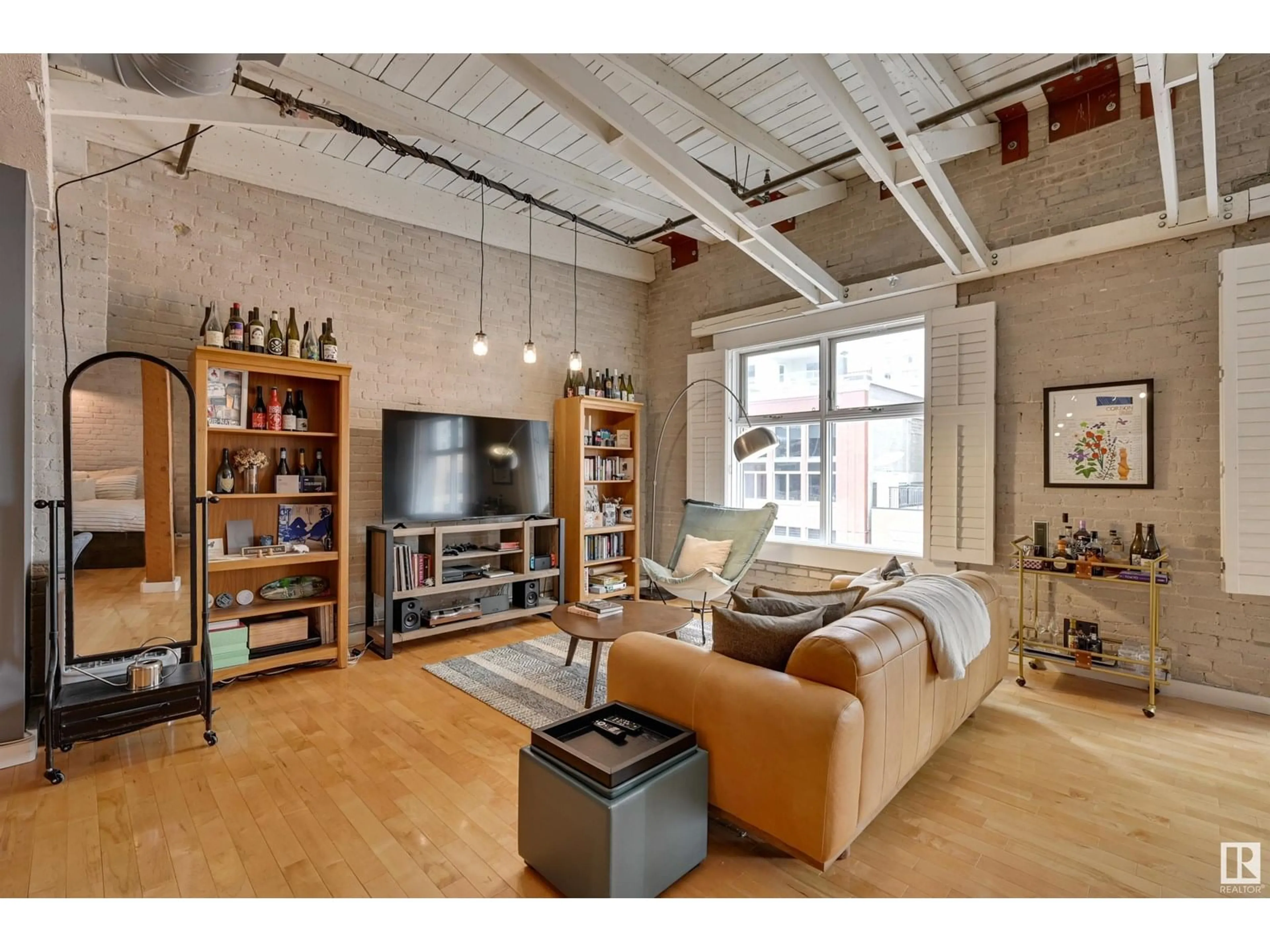 Living room with furniture, cement floor for #504 - 10169 104 ST, Edmonton Alberta T5J1A5