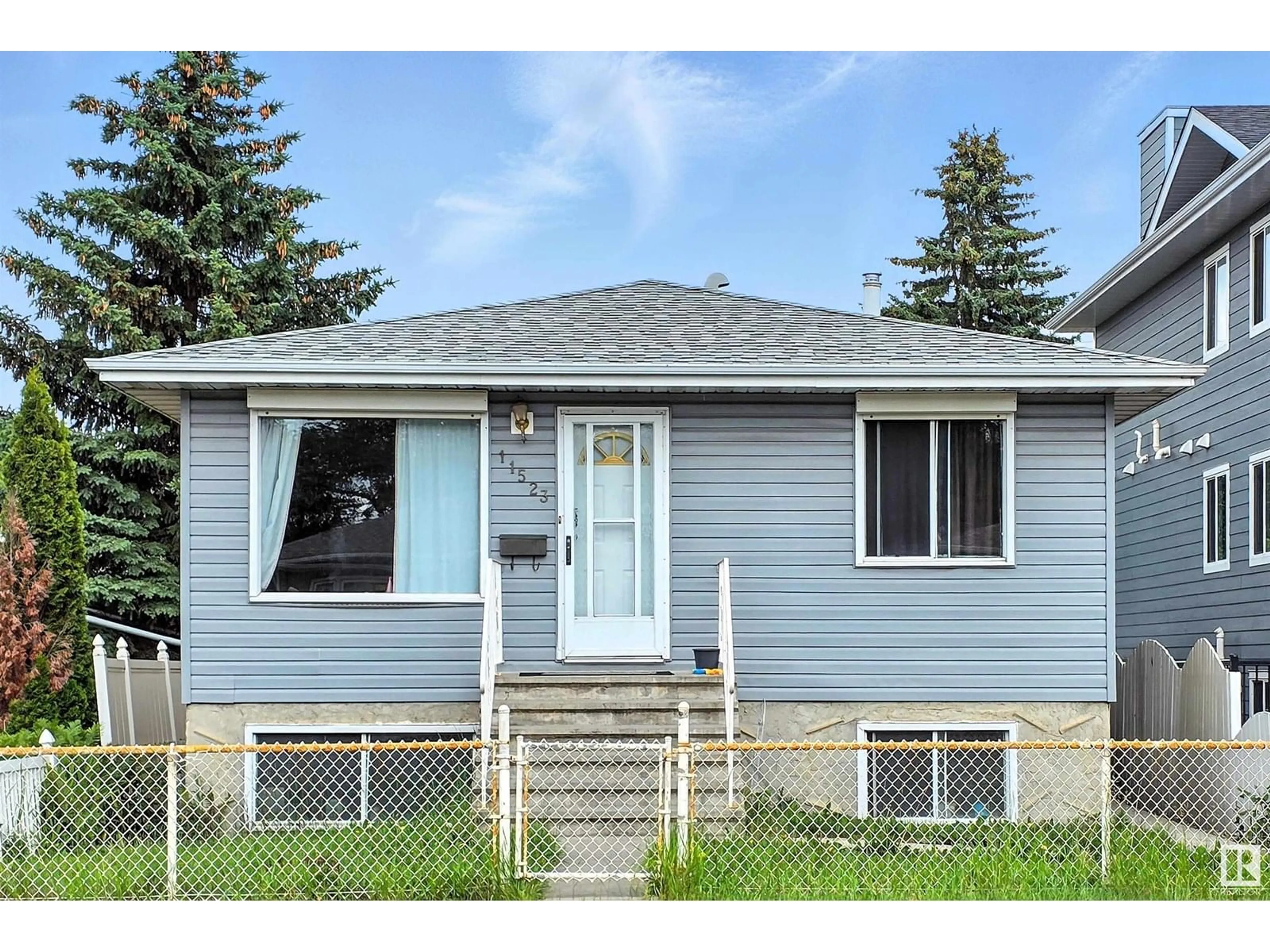 Home with vinyl exterior material, street for NW - 11523 82 ST, Edmonton Alberta T5B2V7