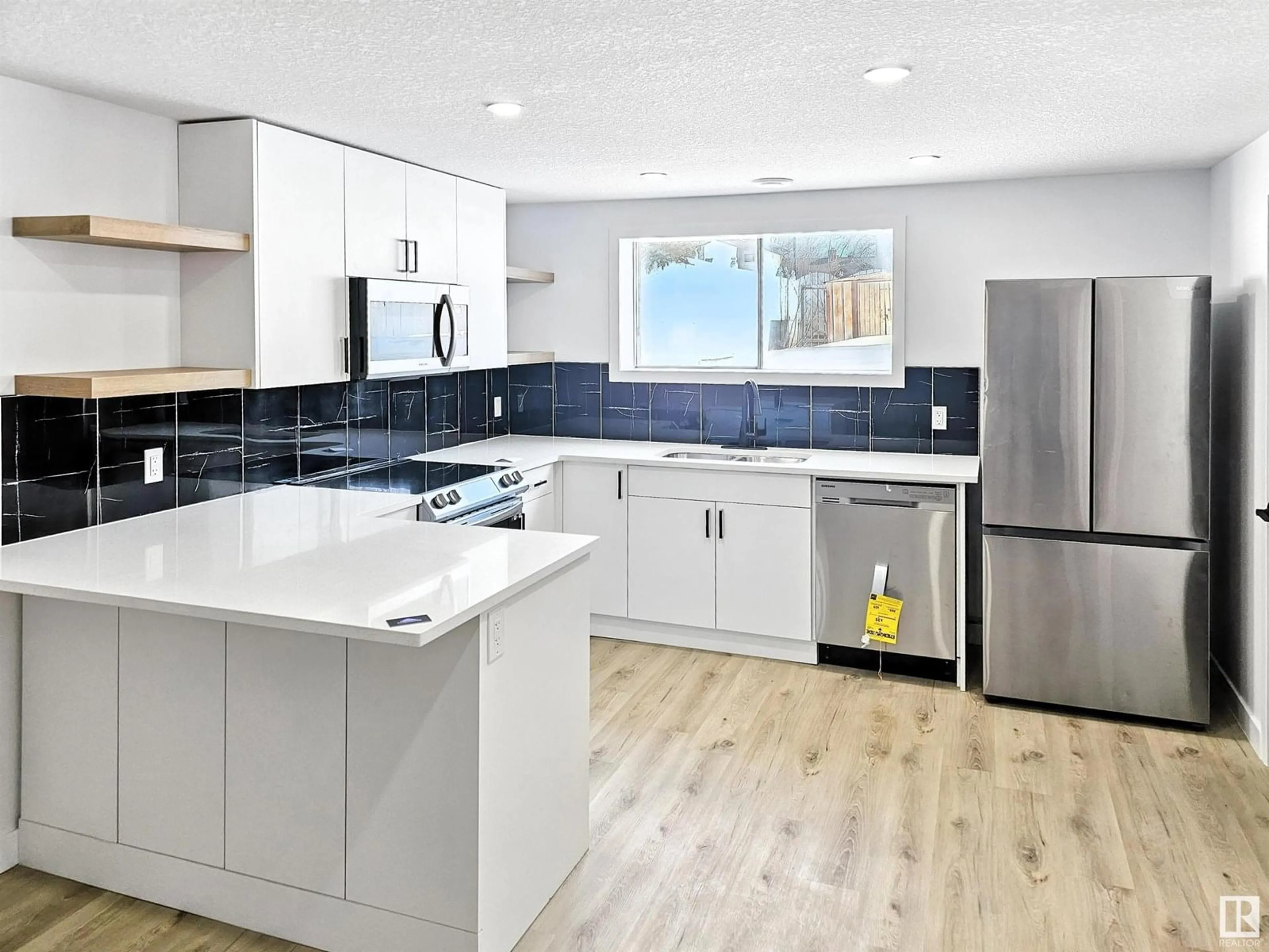 Open concept kitchen, unknown for NW - 11523 82 ST, Edmonton Alberta T5B2V7