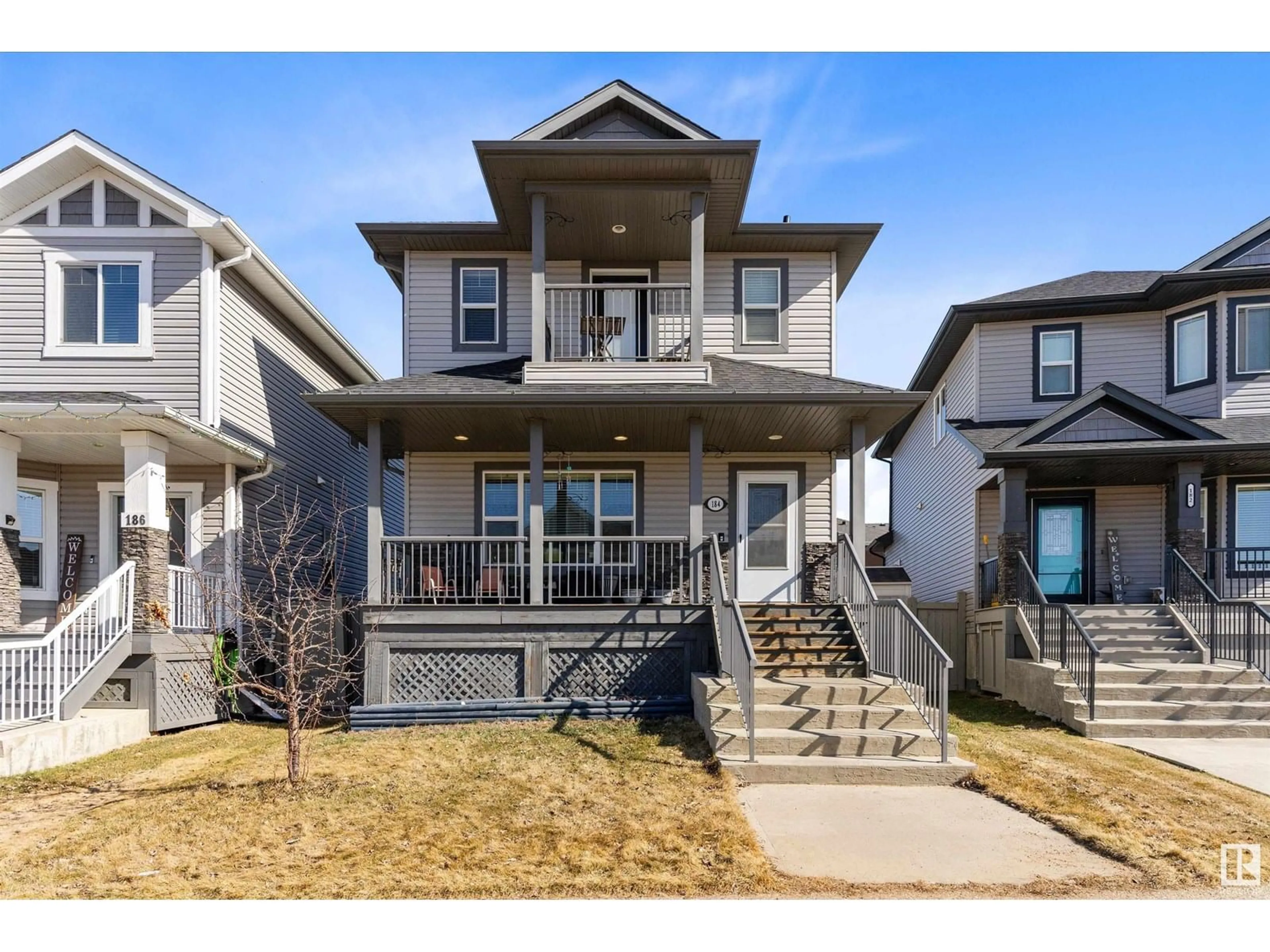Home with vinyl exterior material, street for 184 ROBINSON DR, Leduc Alberta T9E1B1