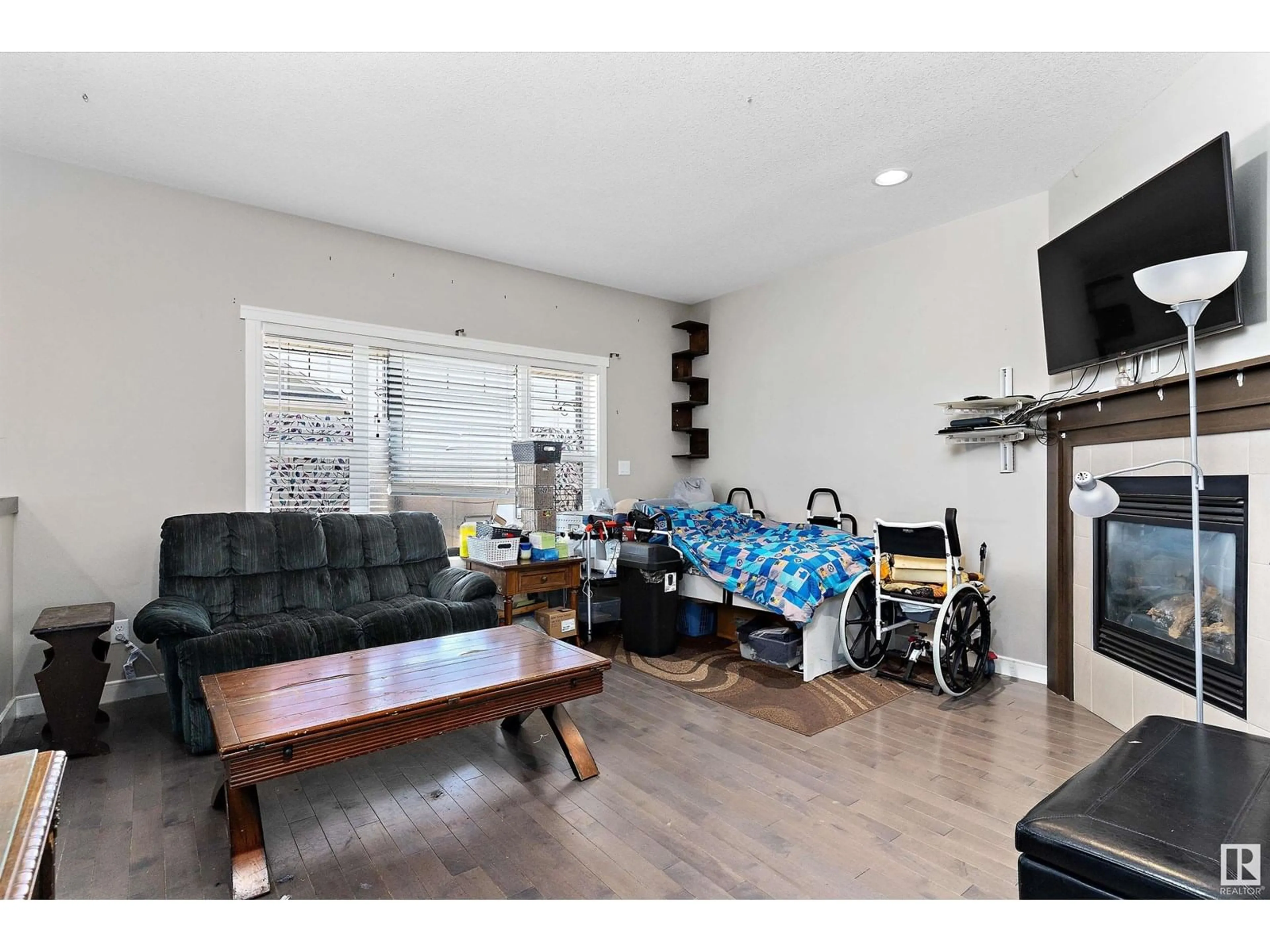 Living room with furniture, wood/laminate floor for 184 ROBINSON DR, Leduc Alberta T9E1B1
