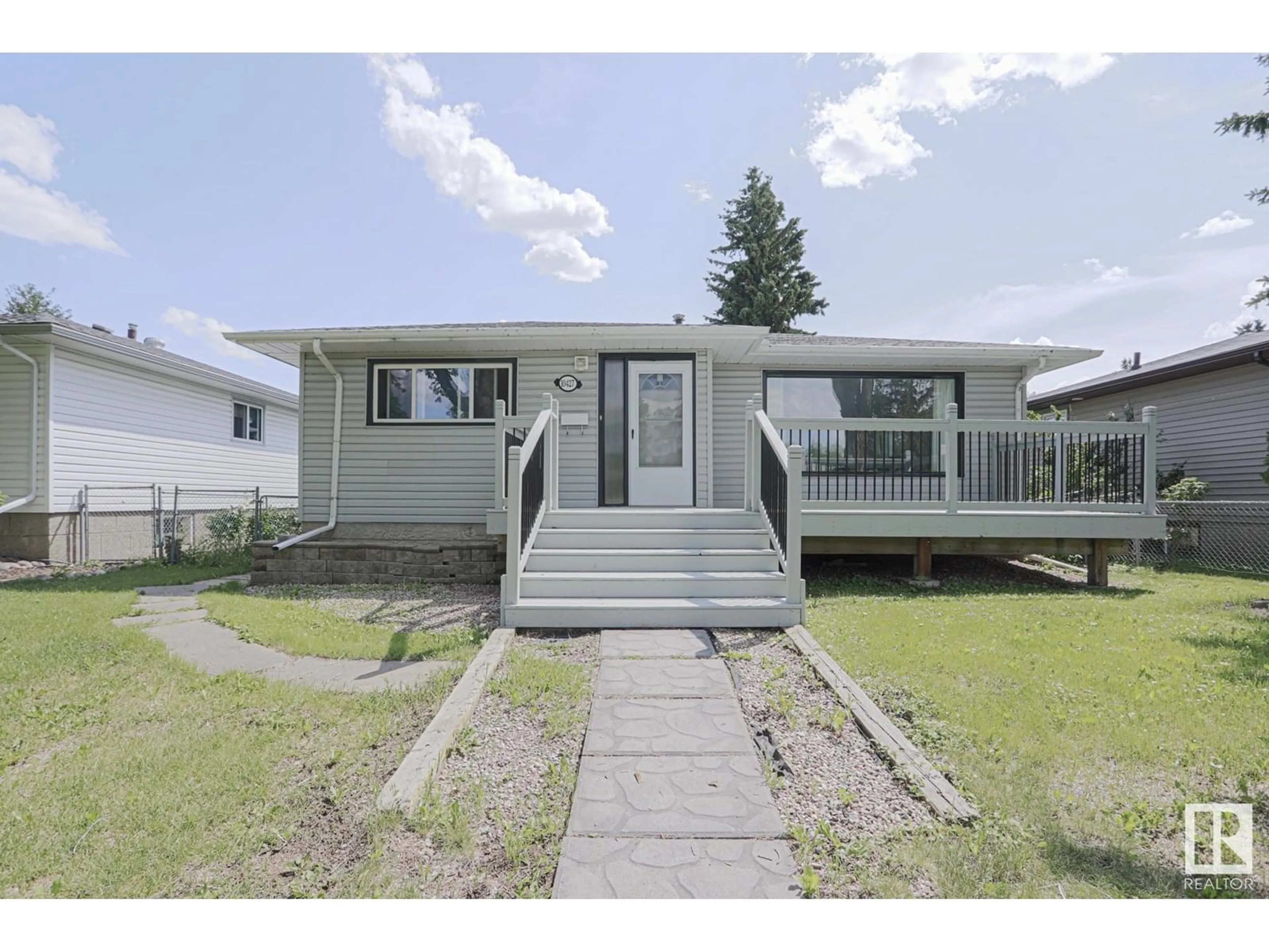 Home with vinyl exterior material, street for 10427 68 AV, Edmonton Alberta T6H2A8