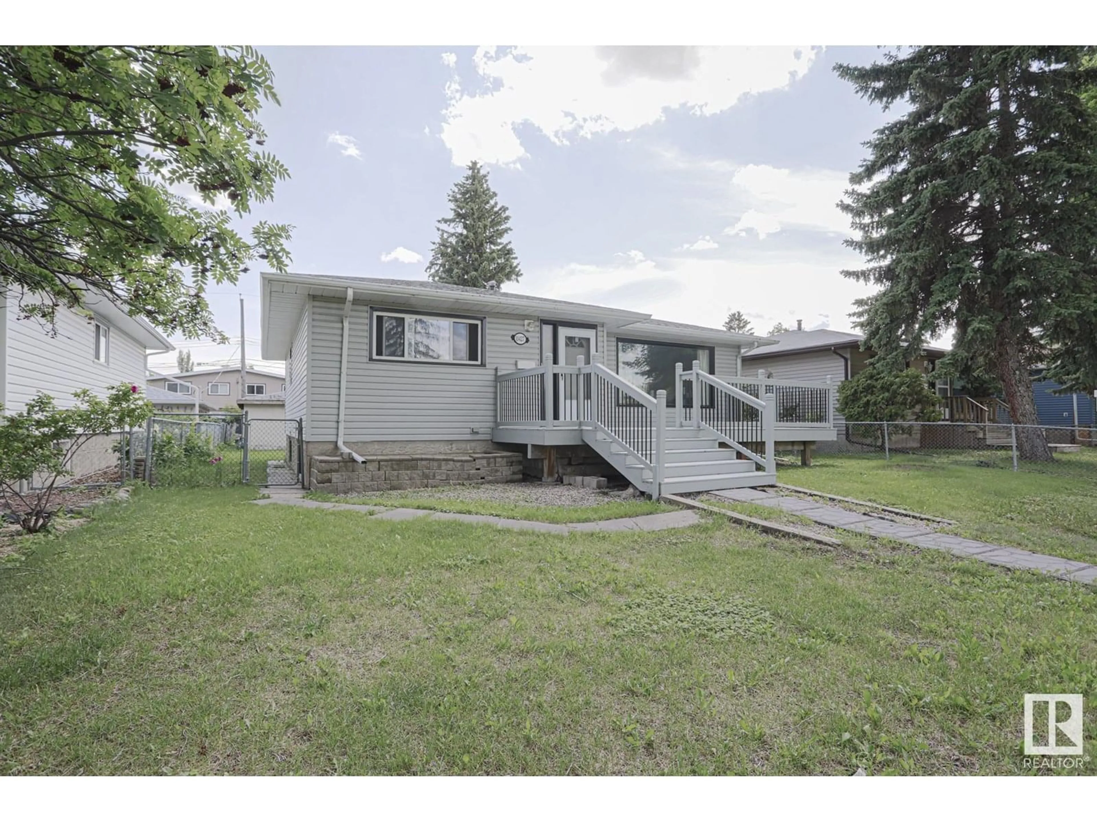 Home with vinyl exterior material, street for 10427 68 AV, Edmonton Alberta T6H2A8