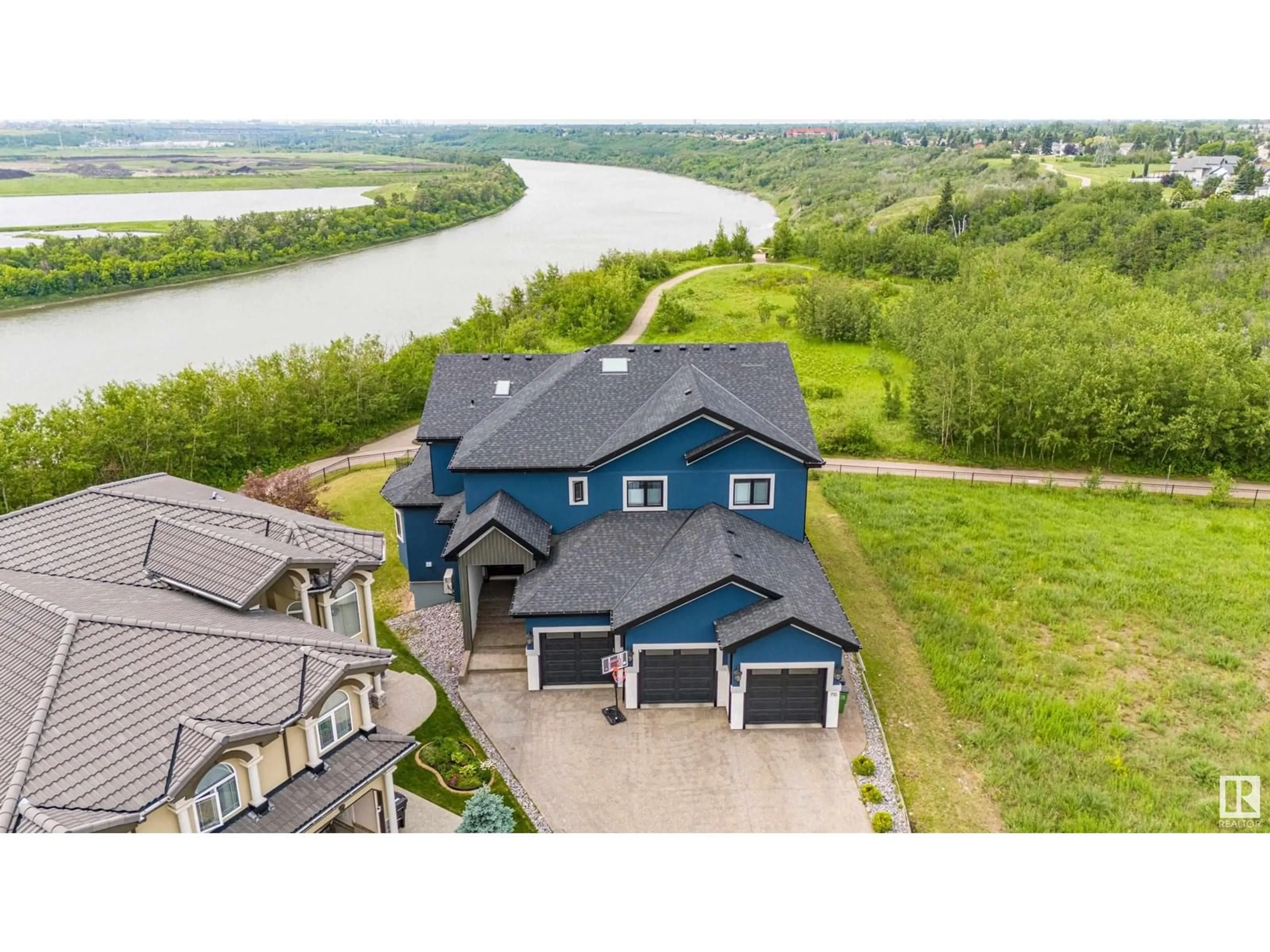 A pic from outside/outdoor area/front of a property/back of a property/a pic from drone, water/lake/river/ocean view for 710 FRASER VISTA VS, Edmonton Alberta T5Y0L6