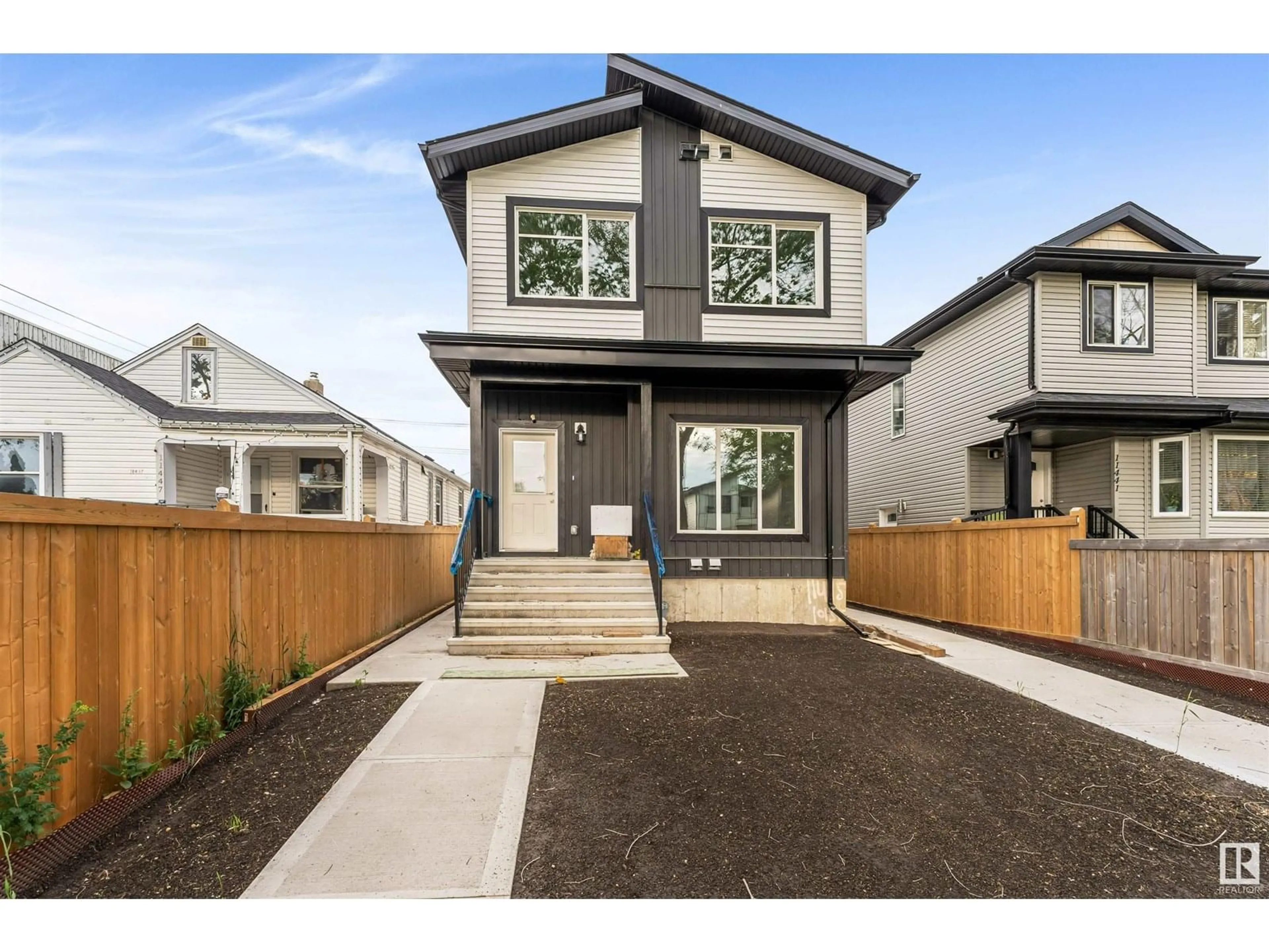Home with vinyl exterior material, street for 11443 101 ST, Edmonton Alberta T5G2A9