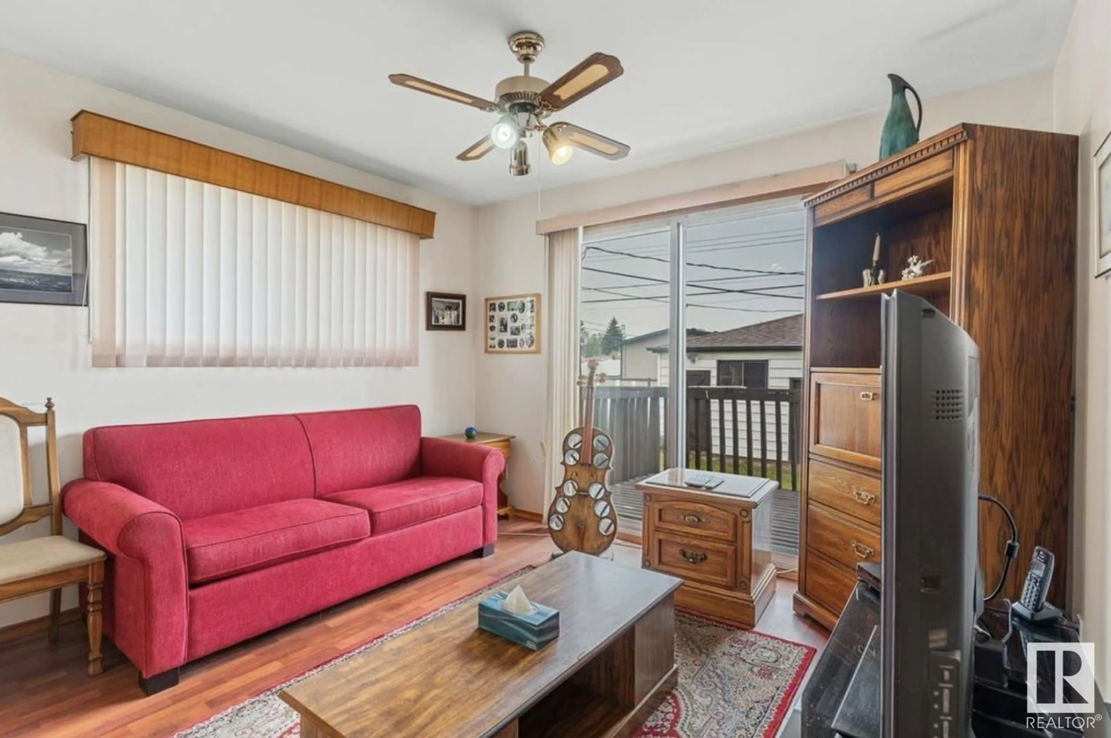 Living room with furniture, wood/laminate floor for 7803 130 AVENUE AVENUE, Edmonton Alberta T5C1Y4