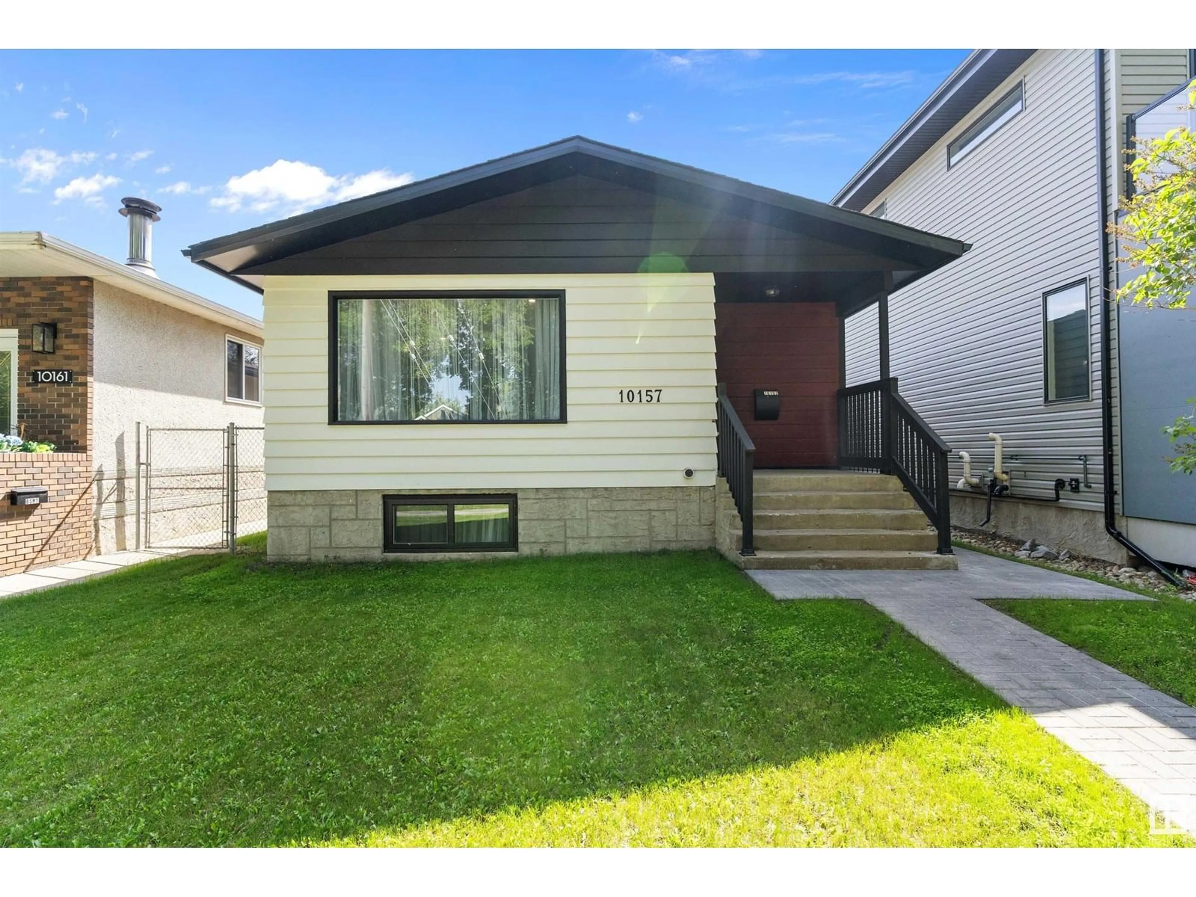 Home with vinyl exterior material, street for NW - 10157 145 ST, Edmonton Alberta T5N2X6