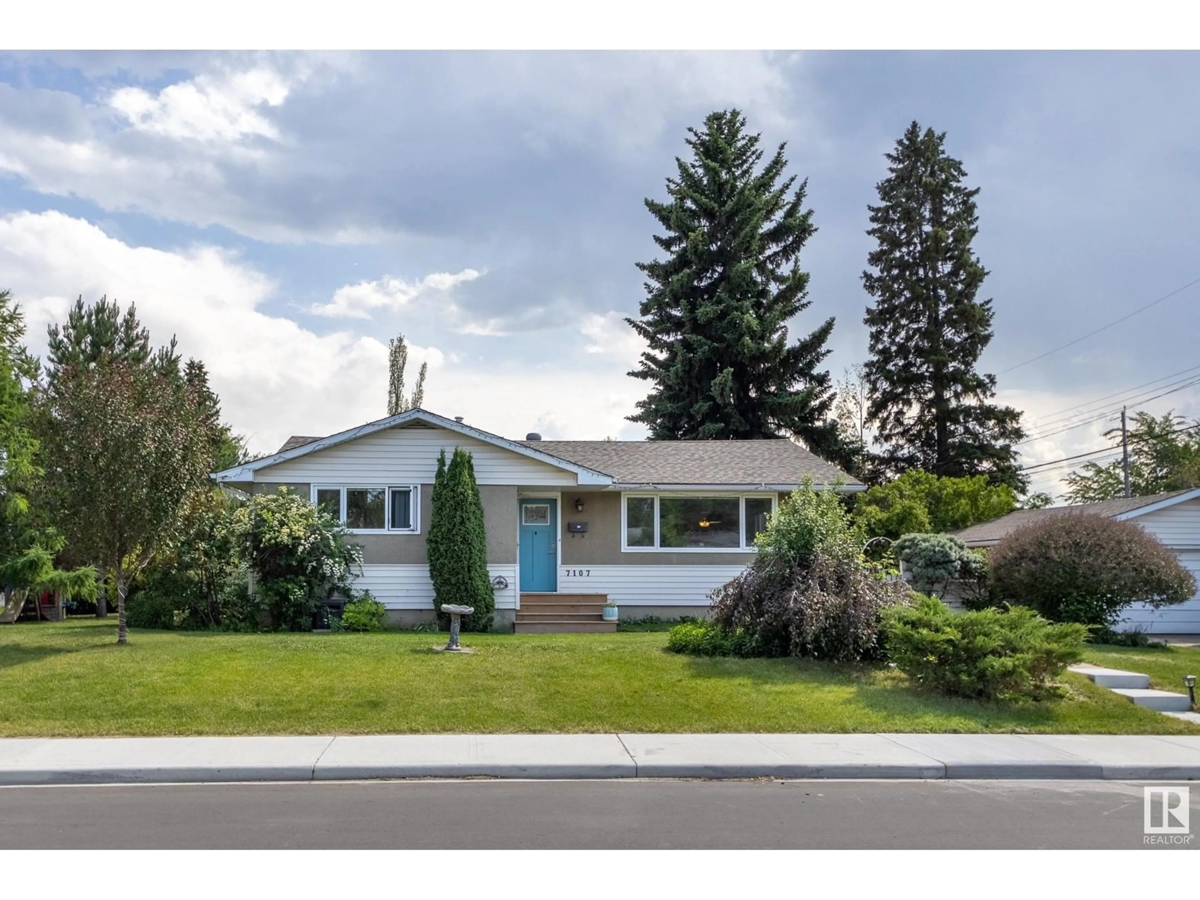 Home with vinyl exterior material, street for 7107 96B AV, Edmonton Alberta T6B1B9