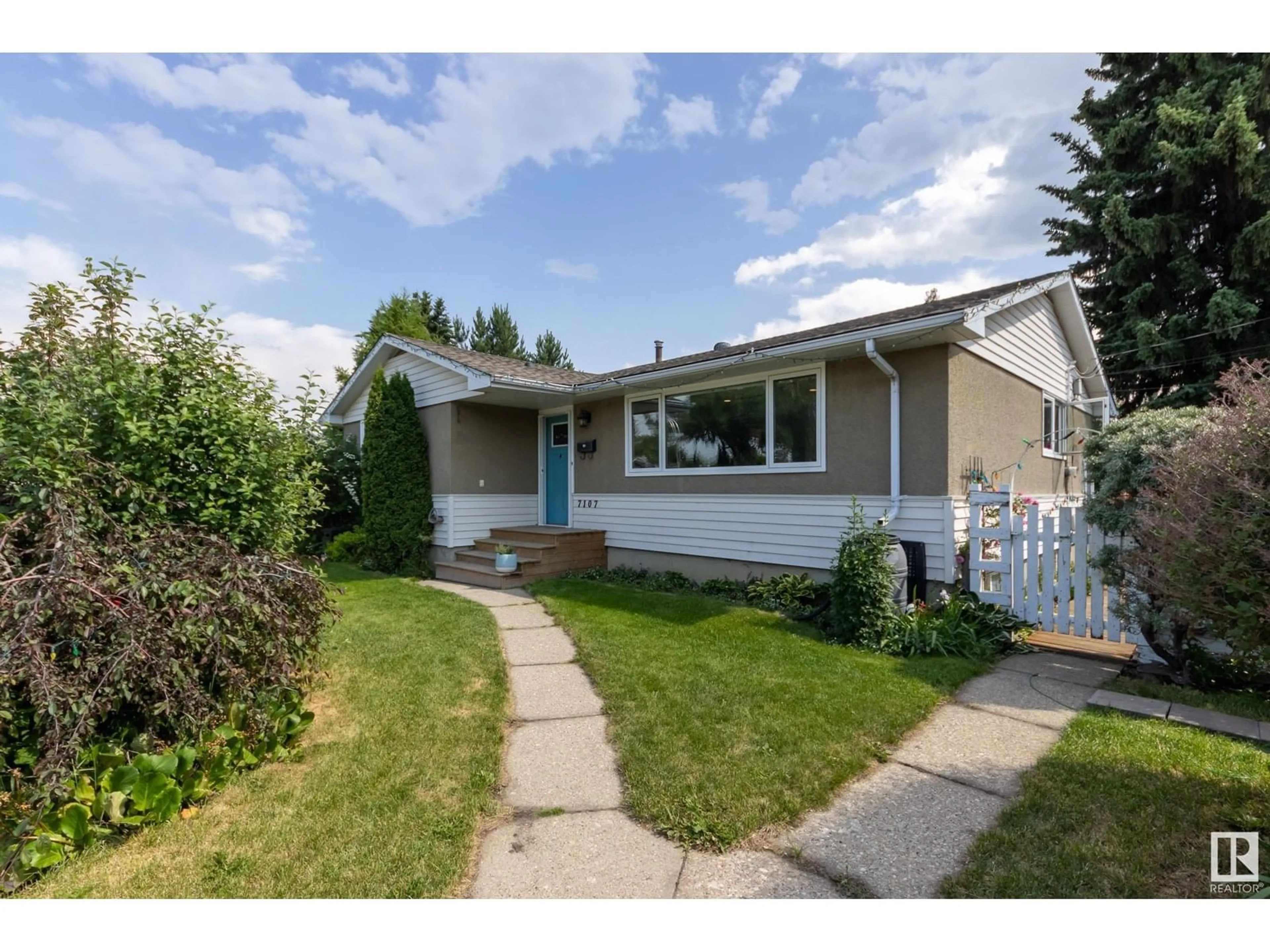 Home with vinyl exterior material, street for 7107 96B AV, Edmonton Alberta T6B1B9
