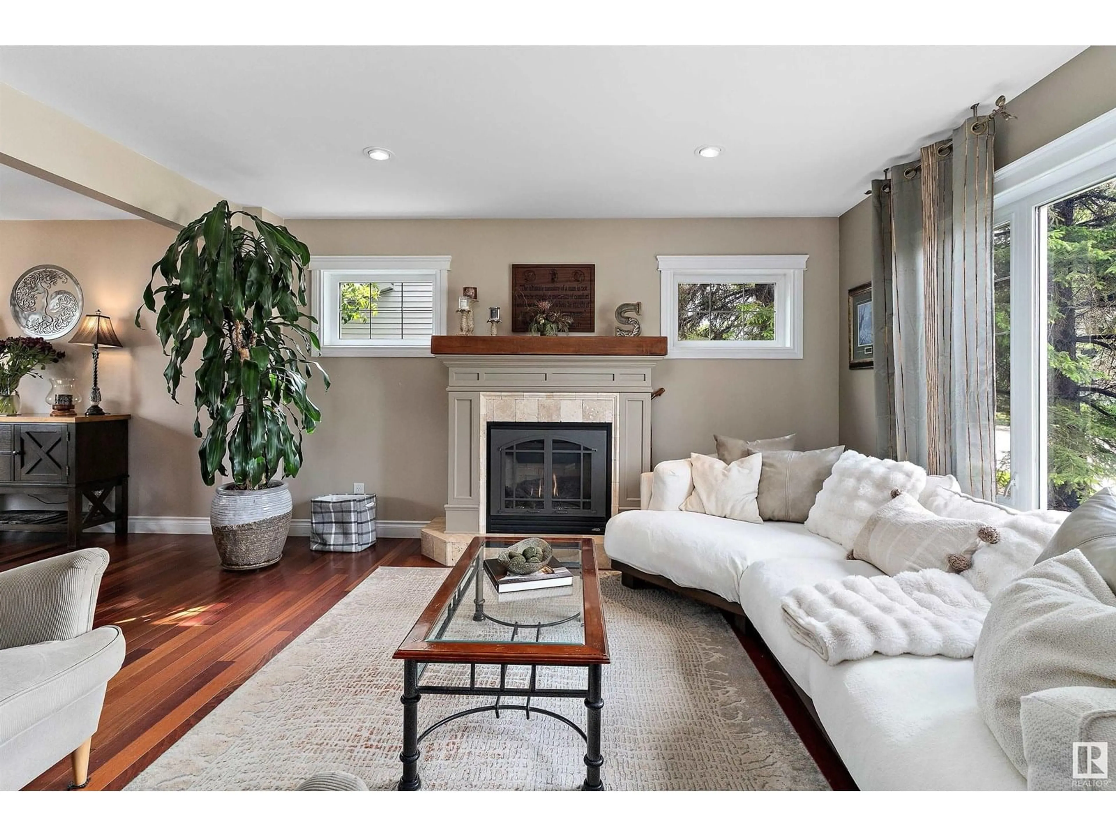 Living room with furniture, wood/laminate floor for NW - 10765 65 ST, Edmonton Alberta T6A2P3