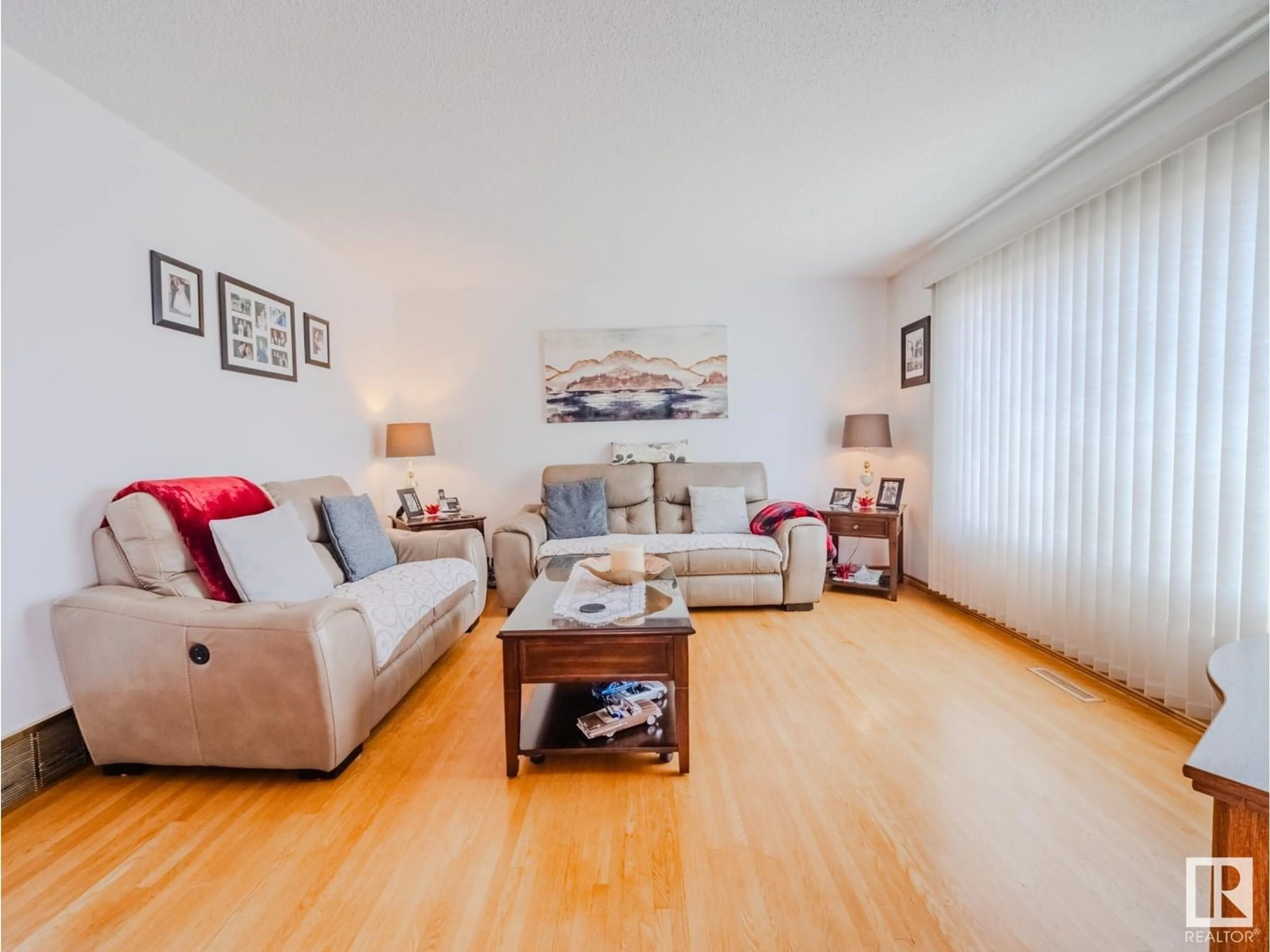 Living room with furniture, wood/laminate floor for NW - 5123 107 ST, Edmonton Alberta T6H2X1
