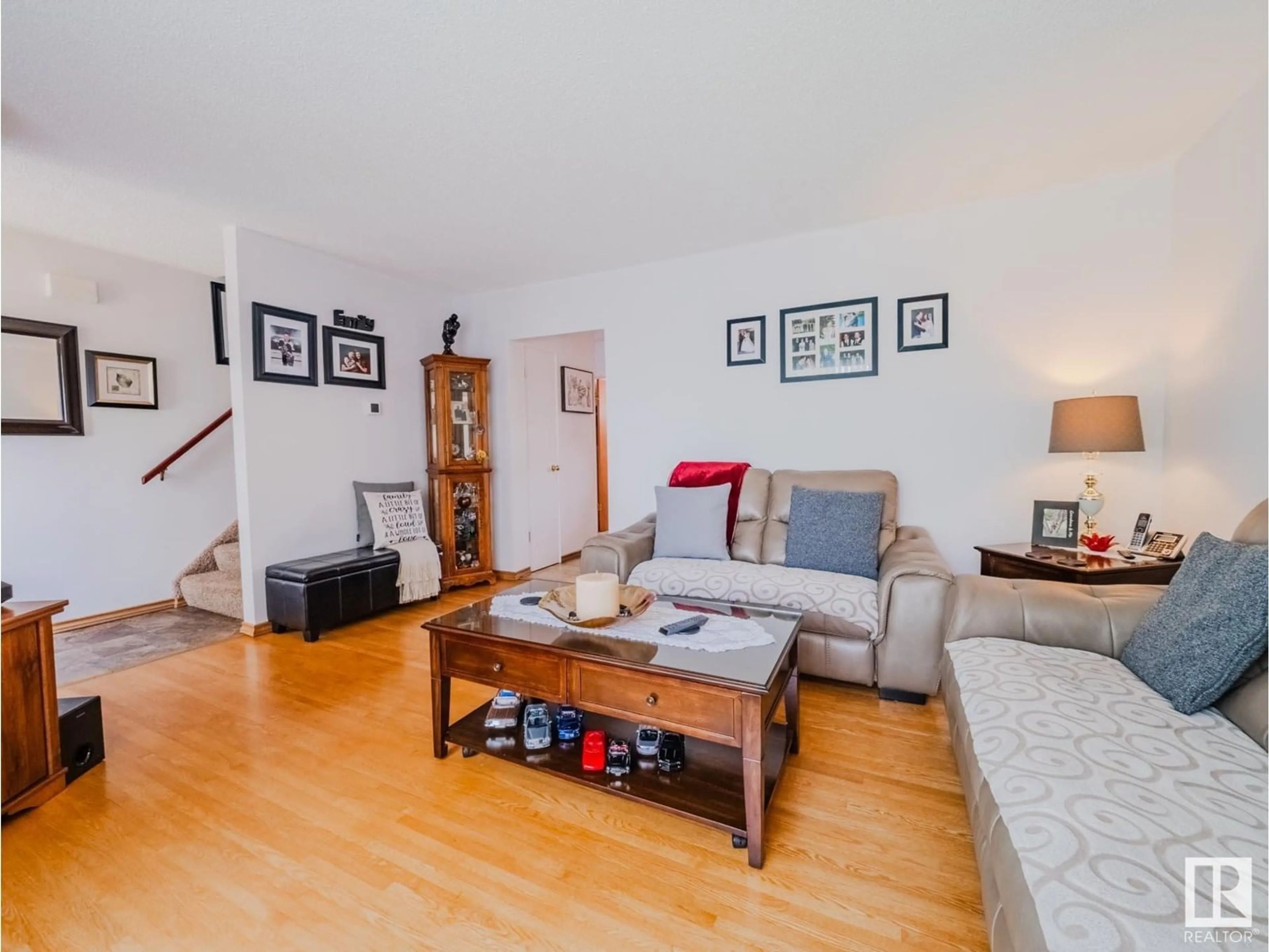 Living room with furniture, wood/laminate floor for NW - 5123 107 ST, Edmonton Alberta T6H2X1
