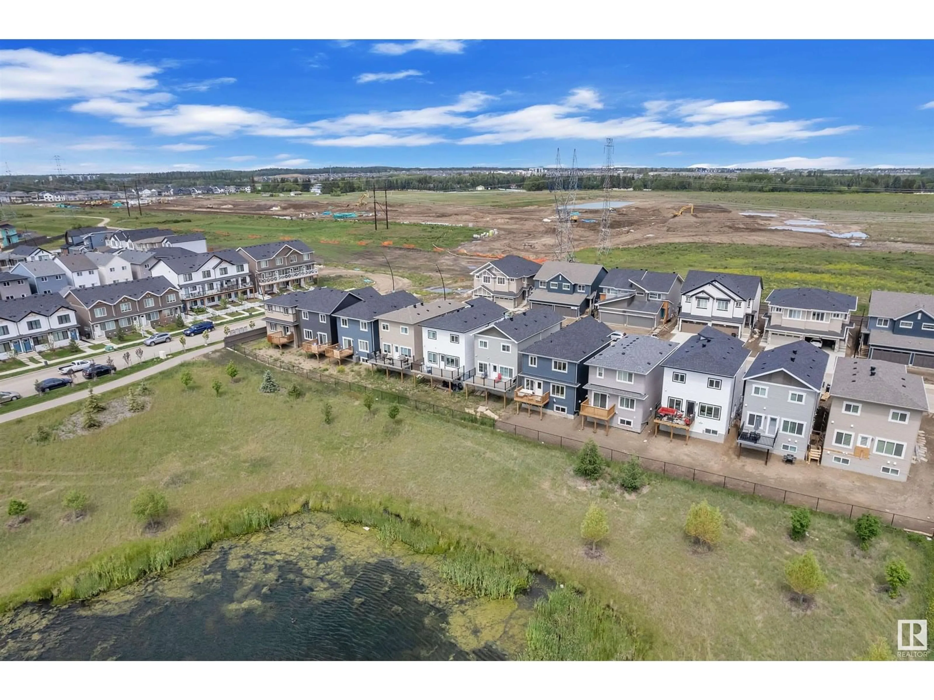 A pic from outside/outdoor area/front of a property/back of a property/a pic from drone, water/lake/river/ocean view for 19131 29 AV, Edmonton Alberta T6M3B5
