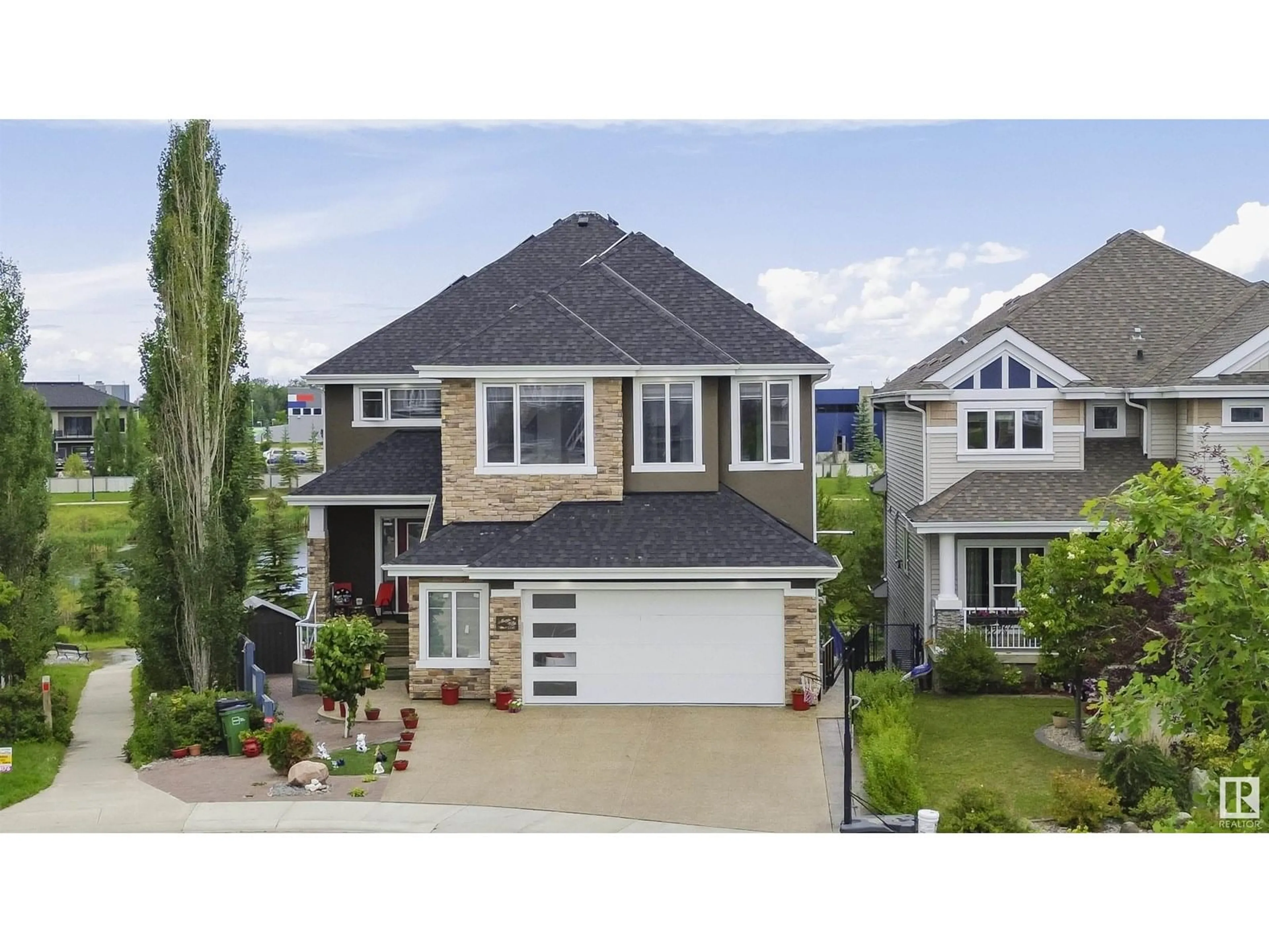 Home with vinyl exterior material, street for 2242 90A ST, Edmonton Alberta T6X0Z9