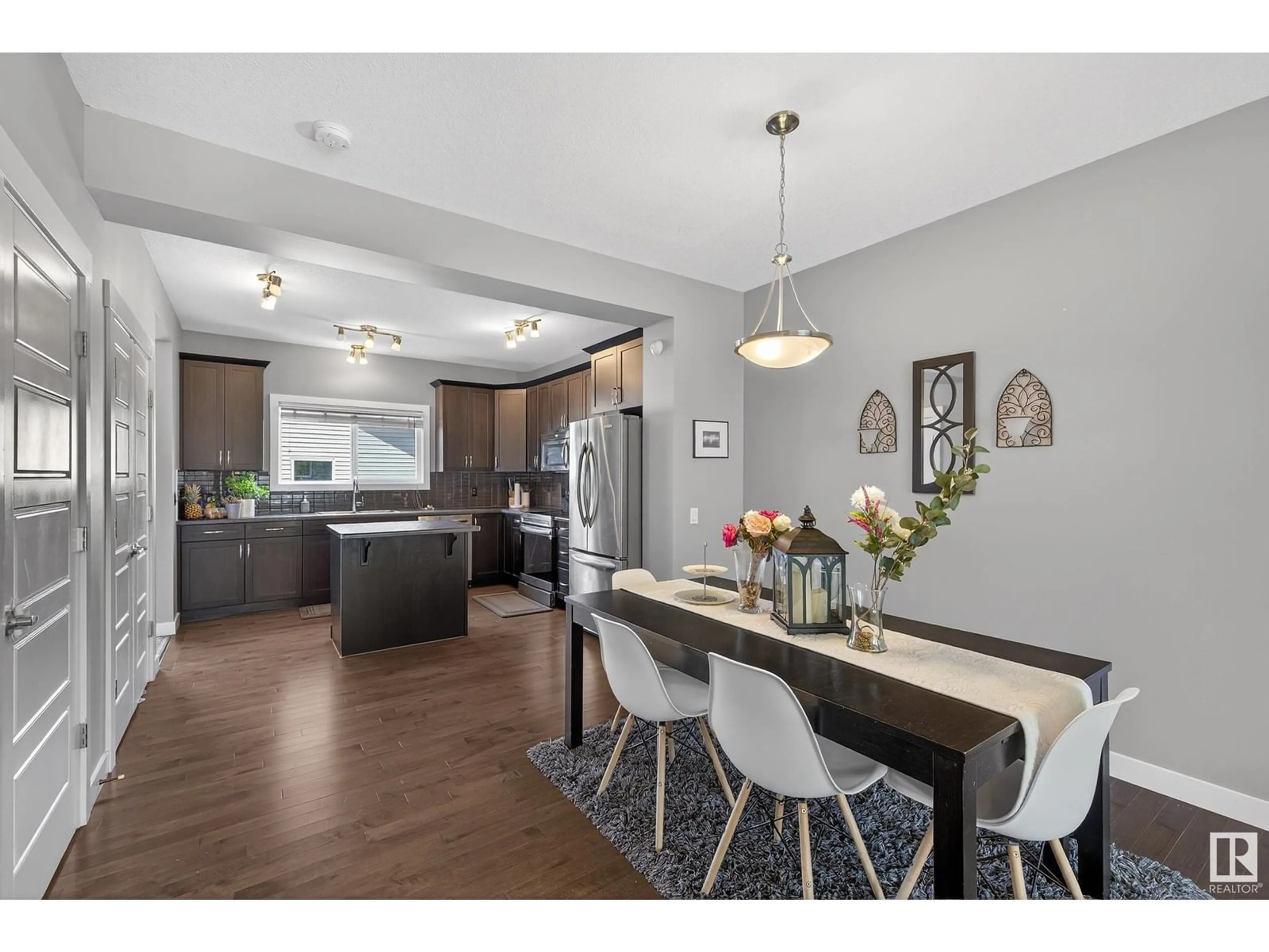 Open concept kitchen, wood/laminate floor for 3112 PAISLEY RD, Edmonton Alberta T6W1A3