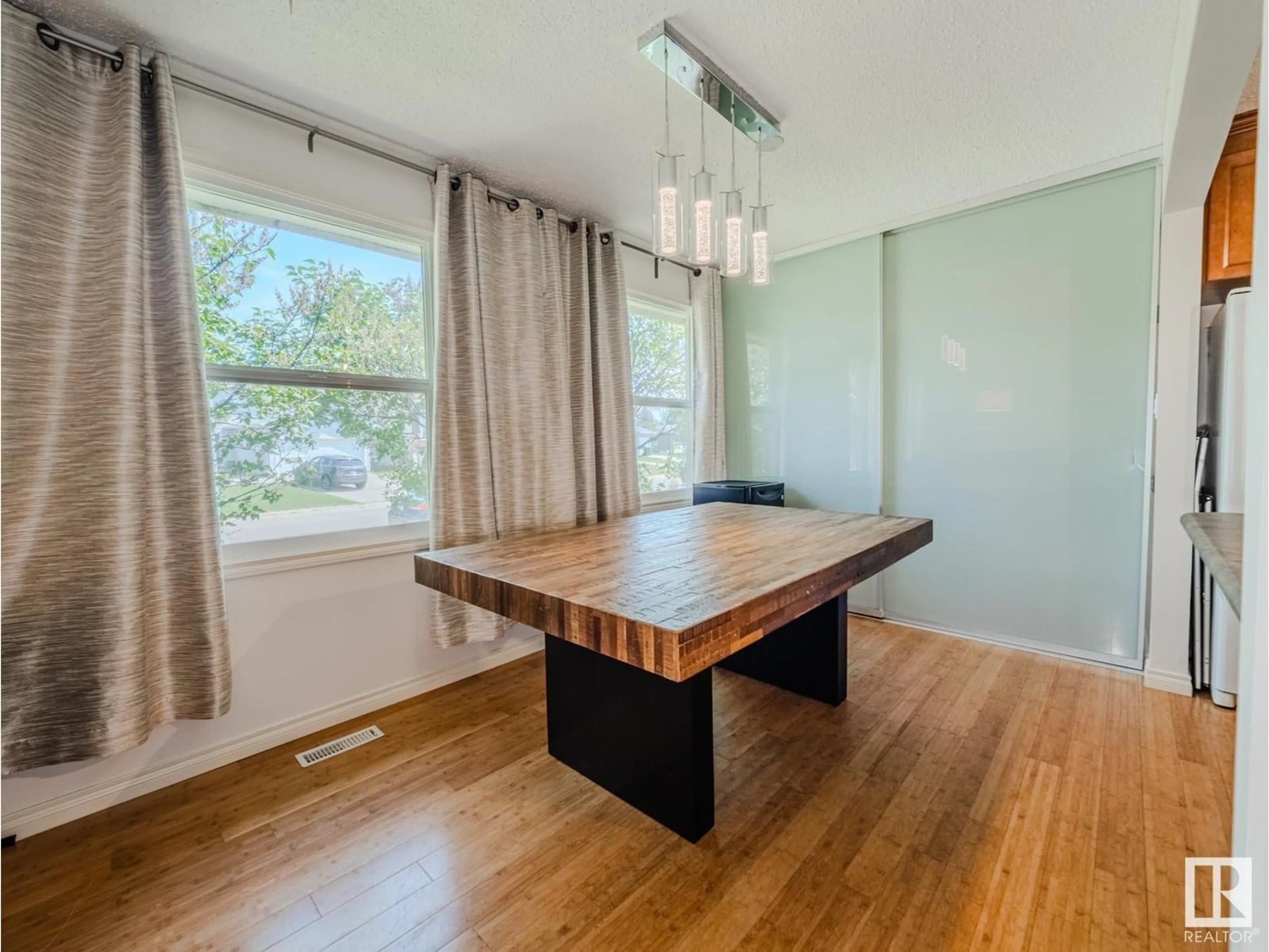 Dining room, wood/laminate floor for 1232 65 ST, Edmonton Alberta T6L2E7