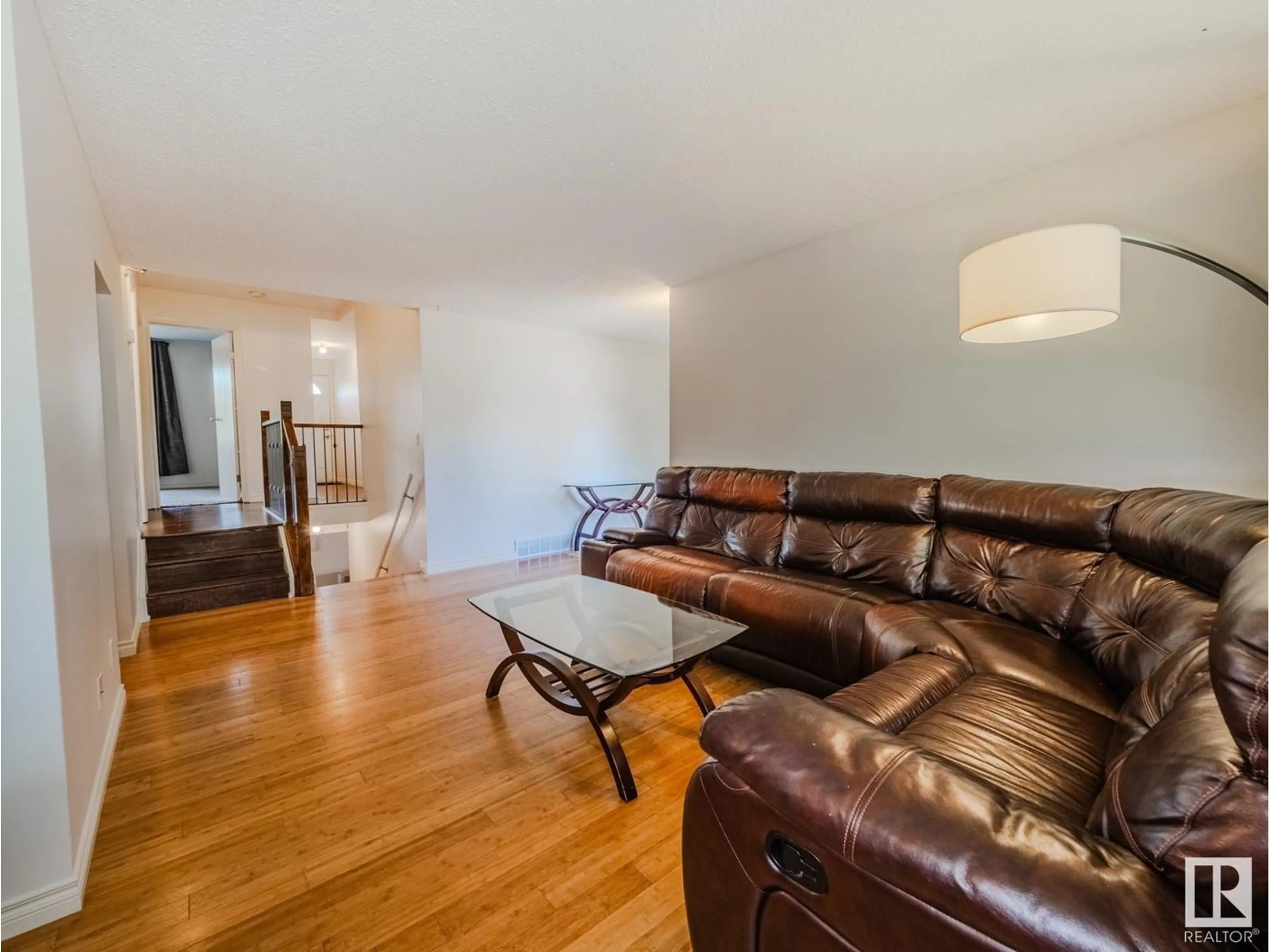 Living room with furniture, wood/laminate floor for 1232 65 ST, Edmonton Alberta T6L2E7