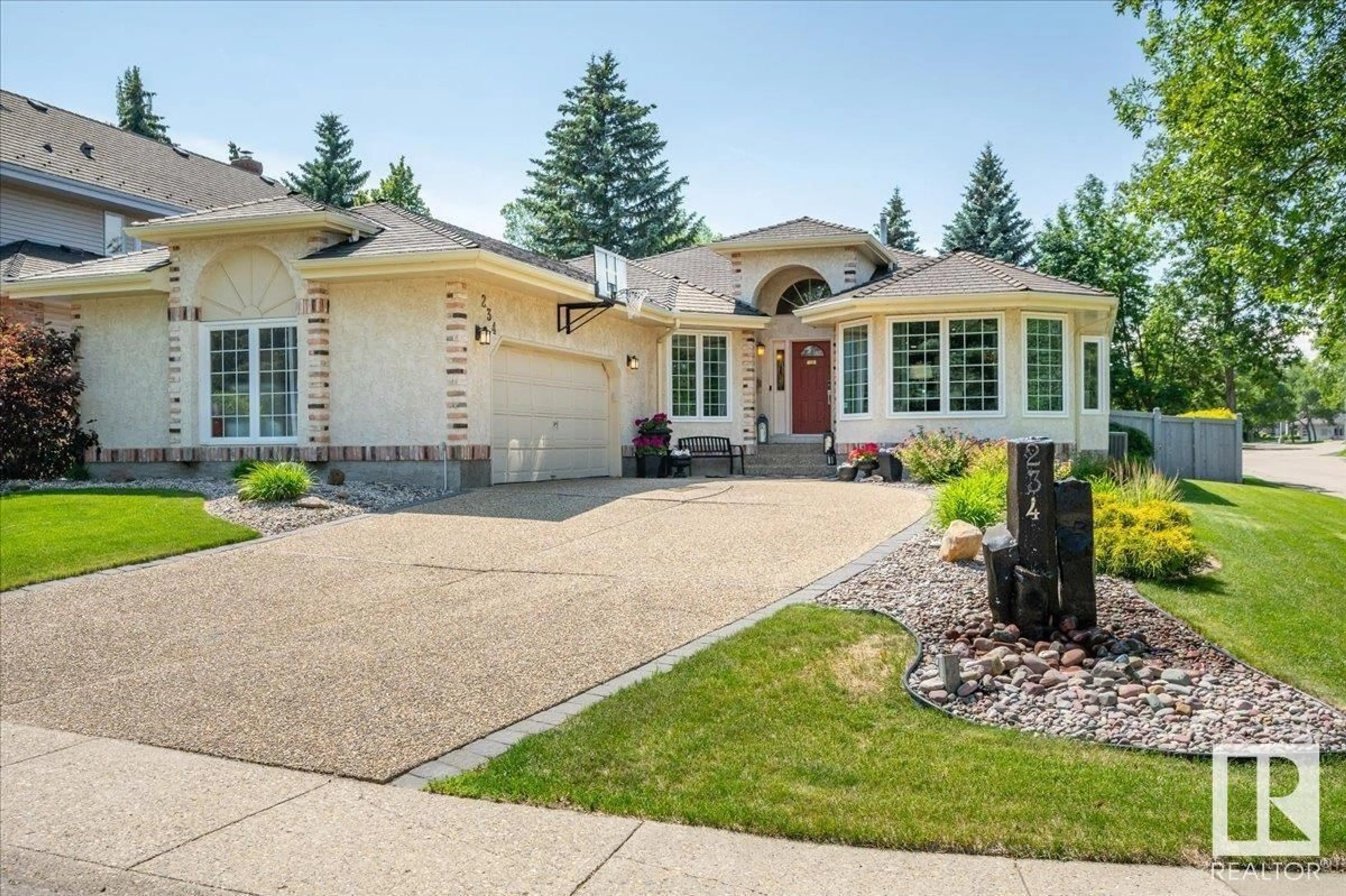 Home with vinyl exterior material, street for 234 OMAND DR, Edmonton Alberta T6R1L3