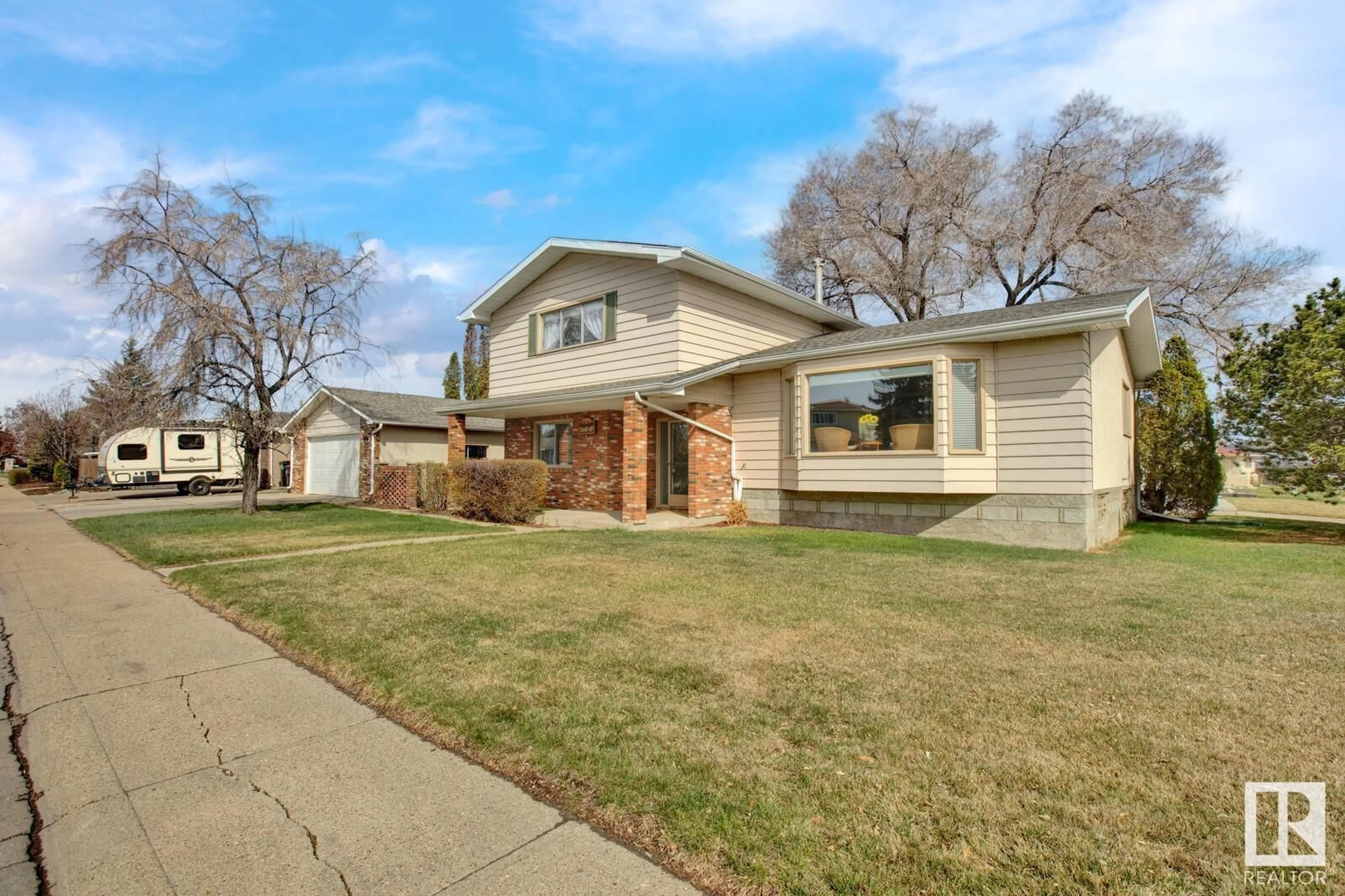 Home with brick exterior material, street for 10804 41 AV, Edmonton Alberta T6J2S1