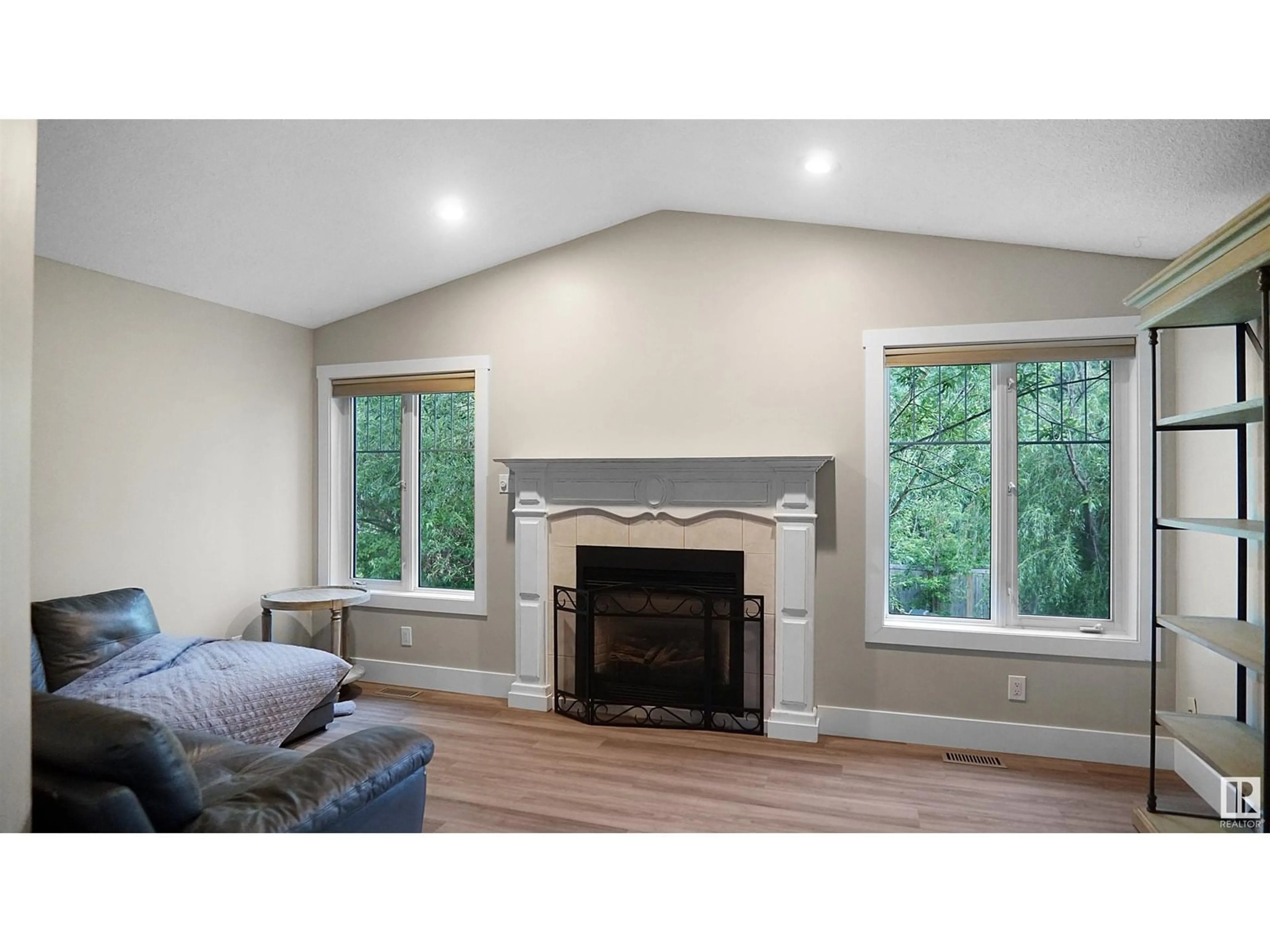 Living room with furniture, wood/laminate floor for 157 SOUTH COOKING LAKE RD, Rural Strathcona County Alberta T8E1J1