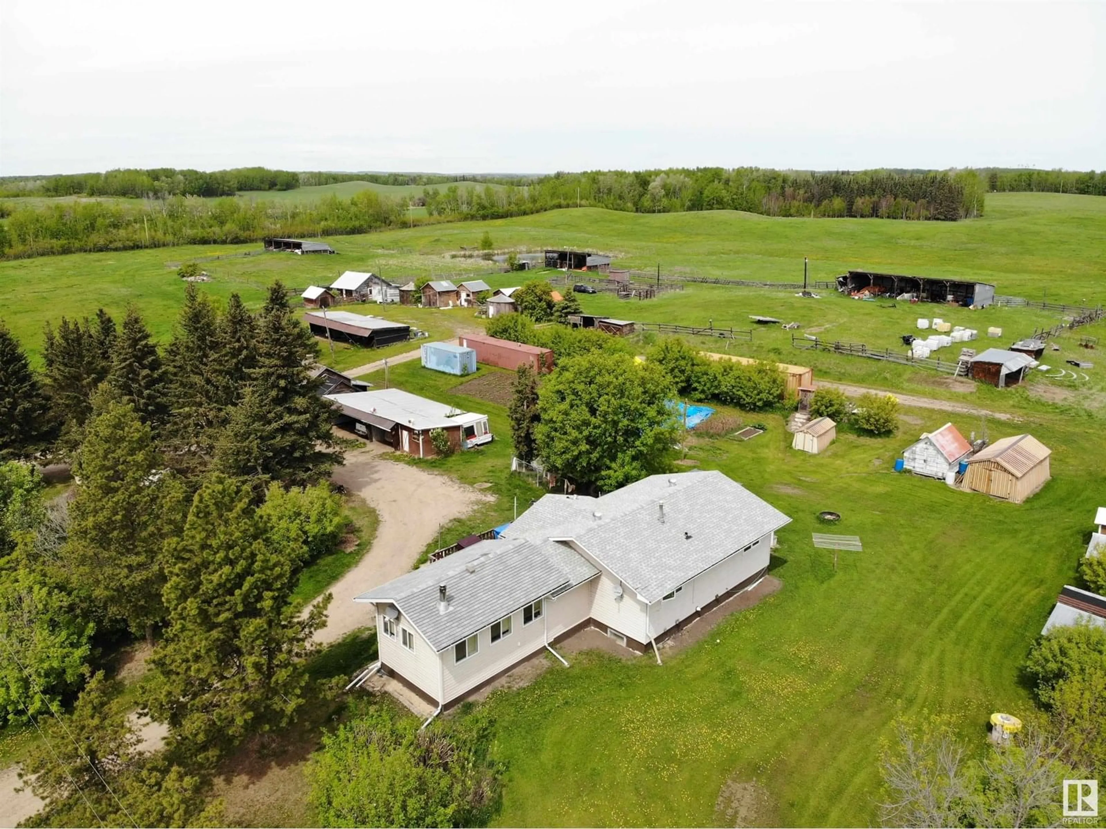 A pic from outside/outdoor area/front of a property/back of a property/a pic from drone, water/lake/river/ocean view for 4230 TWP RD 580, Rural Barrhead County Alberta T7N1N4
