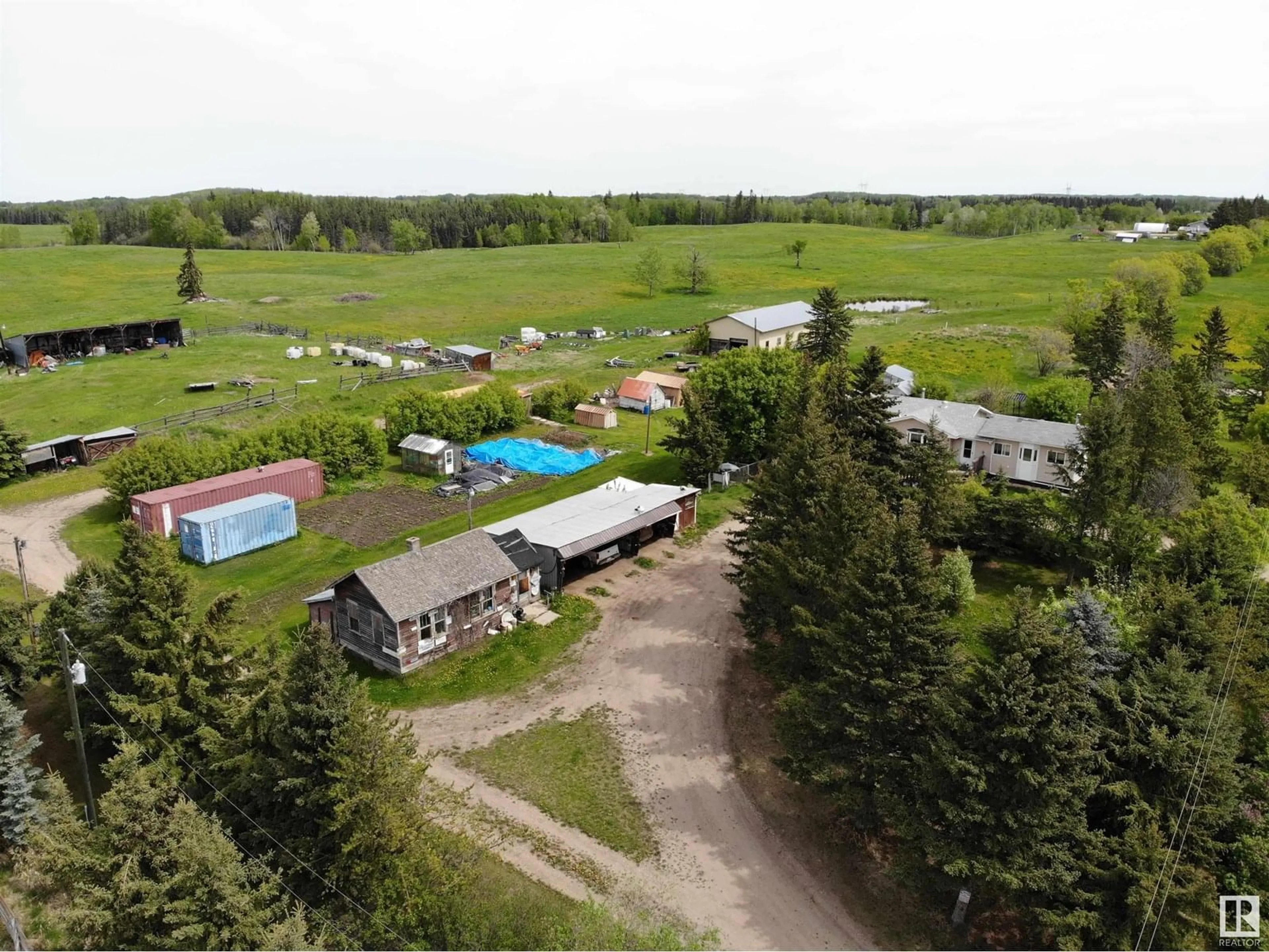A pic from outside/outdoor area/front of a property/back of a property/a pic from drone, mountain view for 4230 TWP RD 580, Rural Barrhead County Alberta T7N1N4