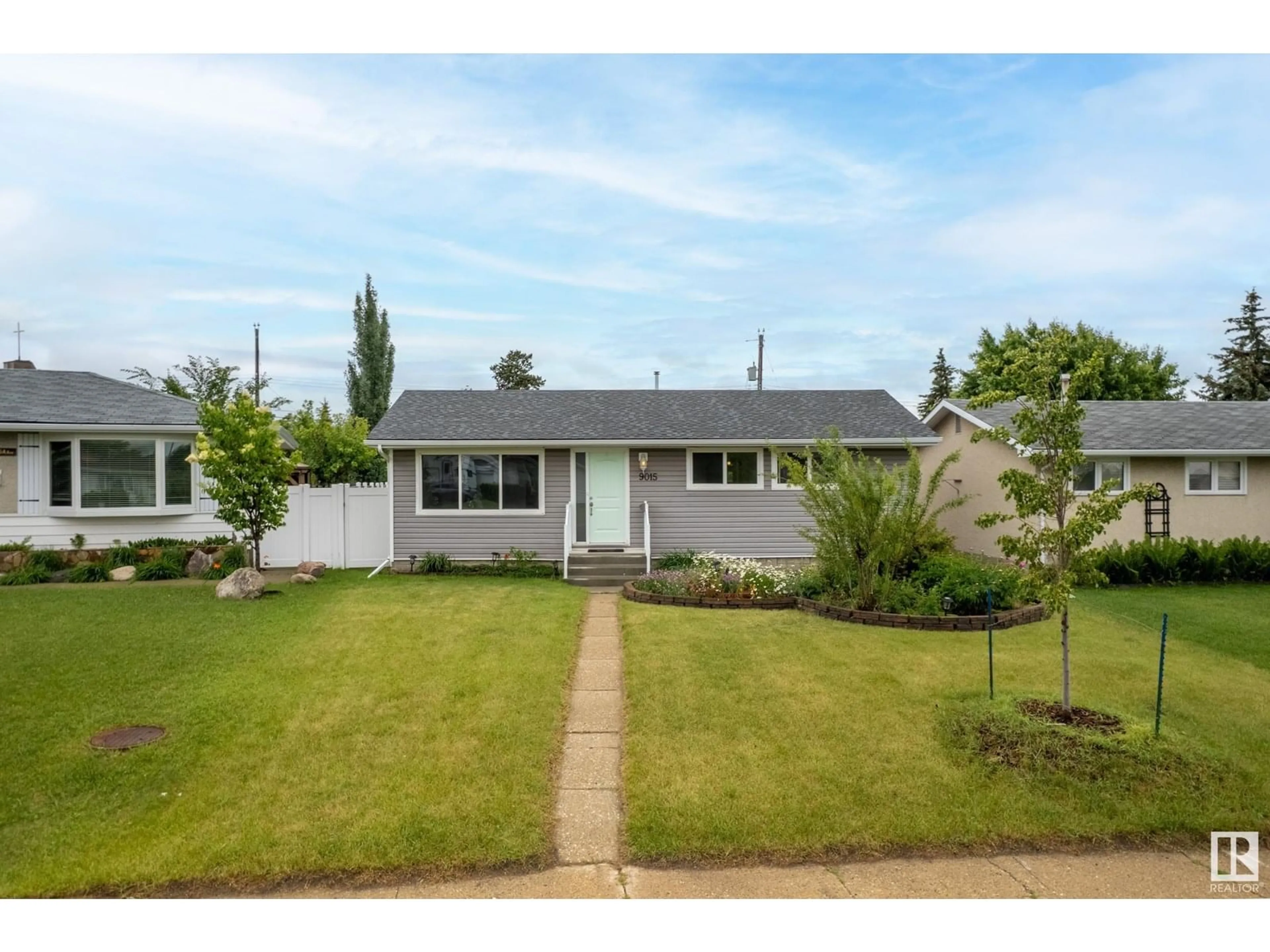 Home with vinyl exterior material, street for 9015 135A AV, Edmonton Alberta T5E1S2