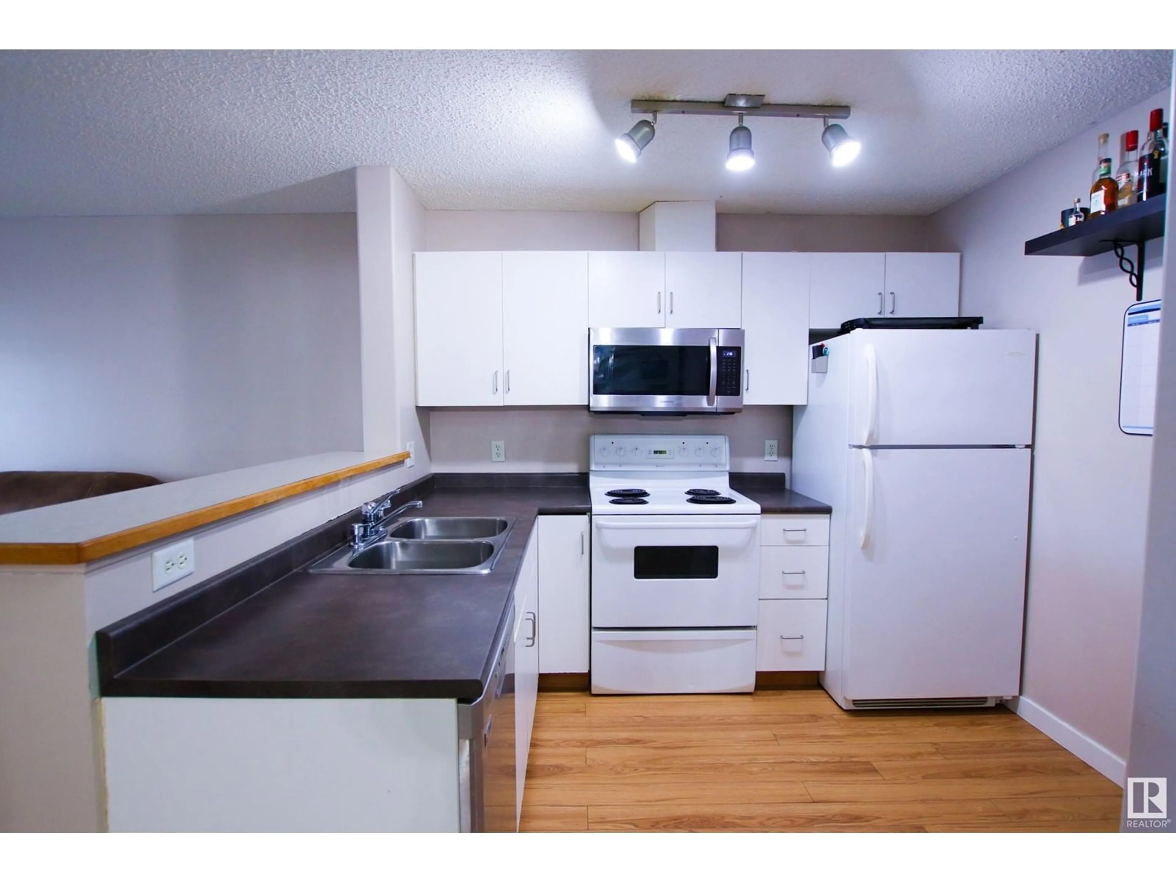 Standard kitchen, wood/laminate floor for #104 - 14708 50 ST, Edmonton Alberta T5A5G9
