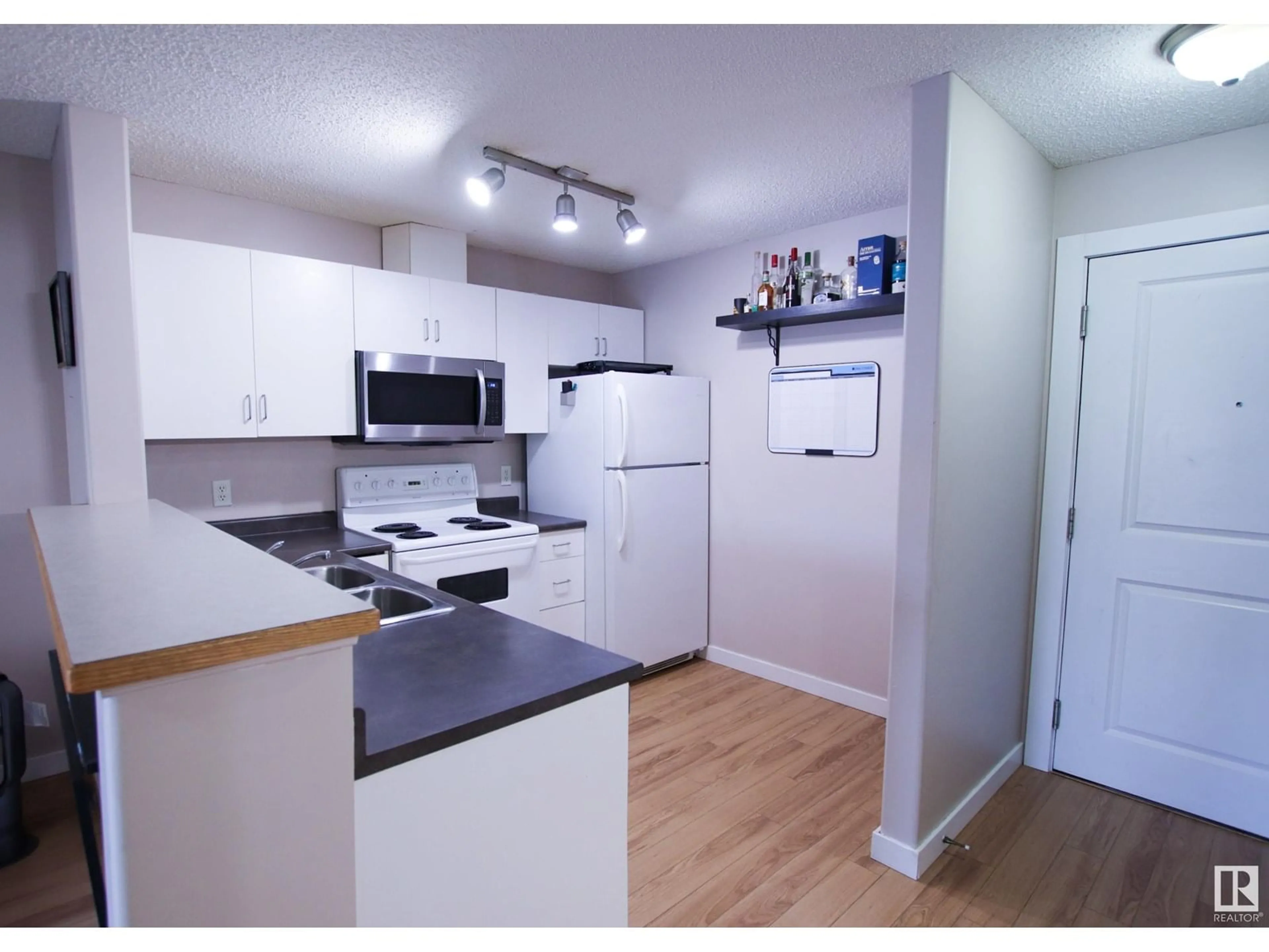 Standard kitchen, wood/laminate floor for #104 - 14708 50 ST, Edmonton Alberta T5A5G9