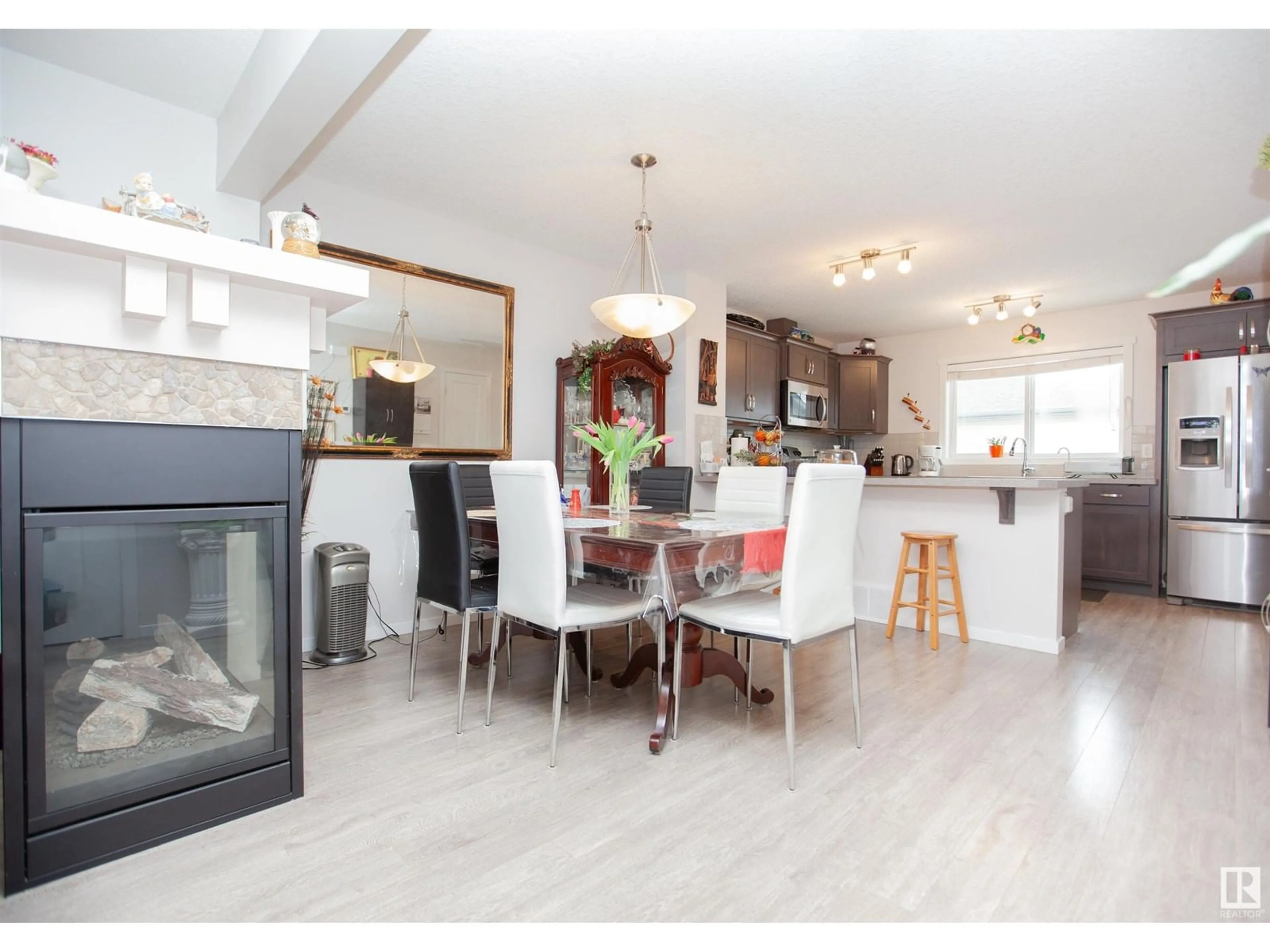 Open concept kitchen, wood/laminate floor for 2902 MAPLE WY, Edmonton Alberta T6T0T4
