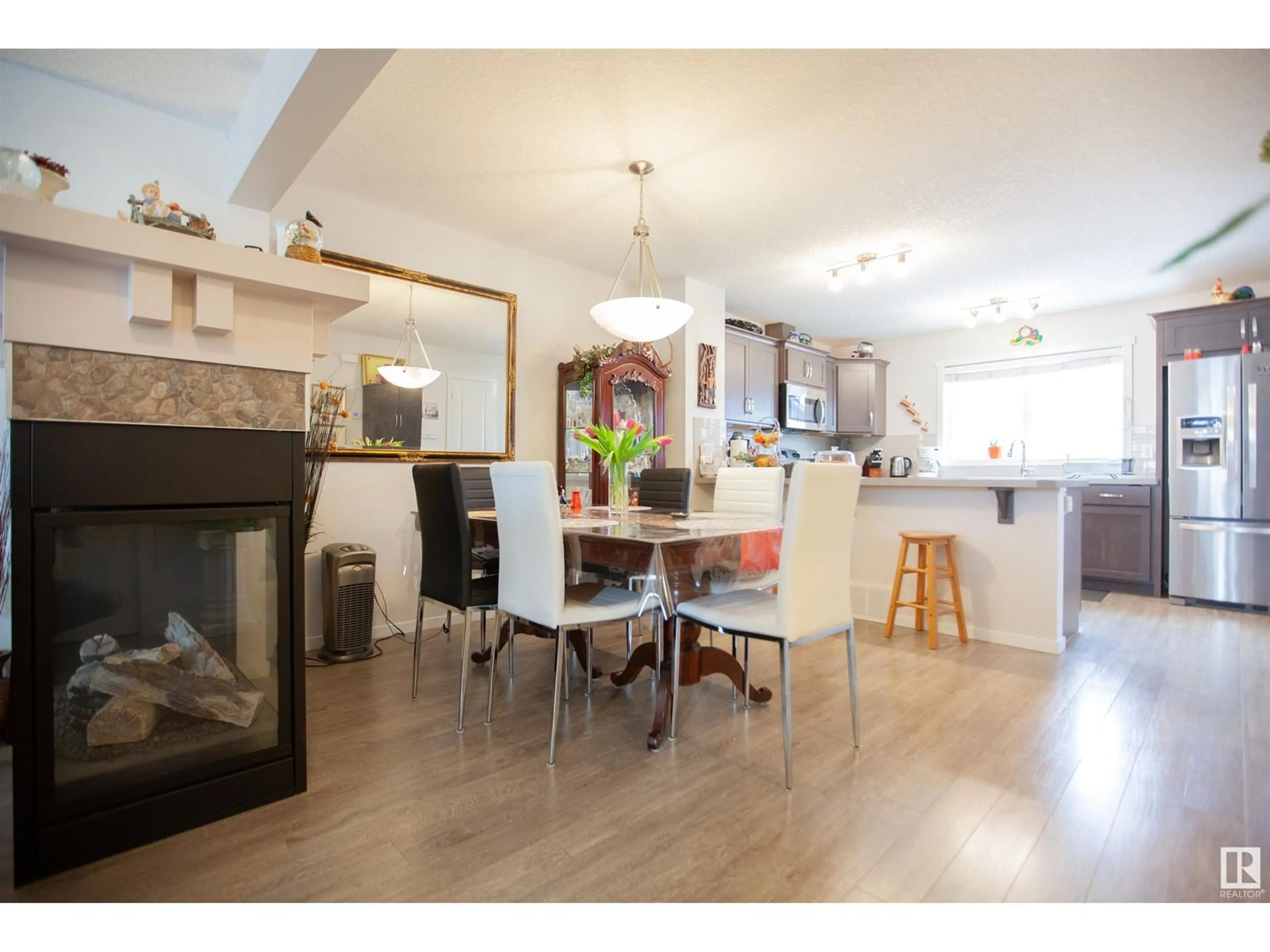 Open concept kitchen, wood/laminate floor for 2902 MAPLE WY, Edmonton Alberta T6T0T4