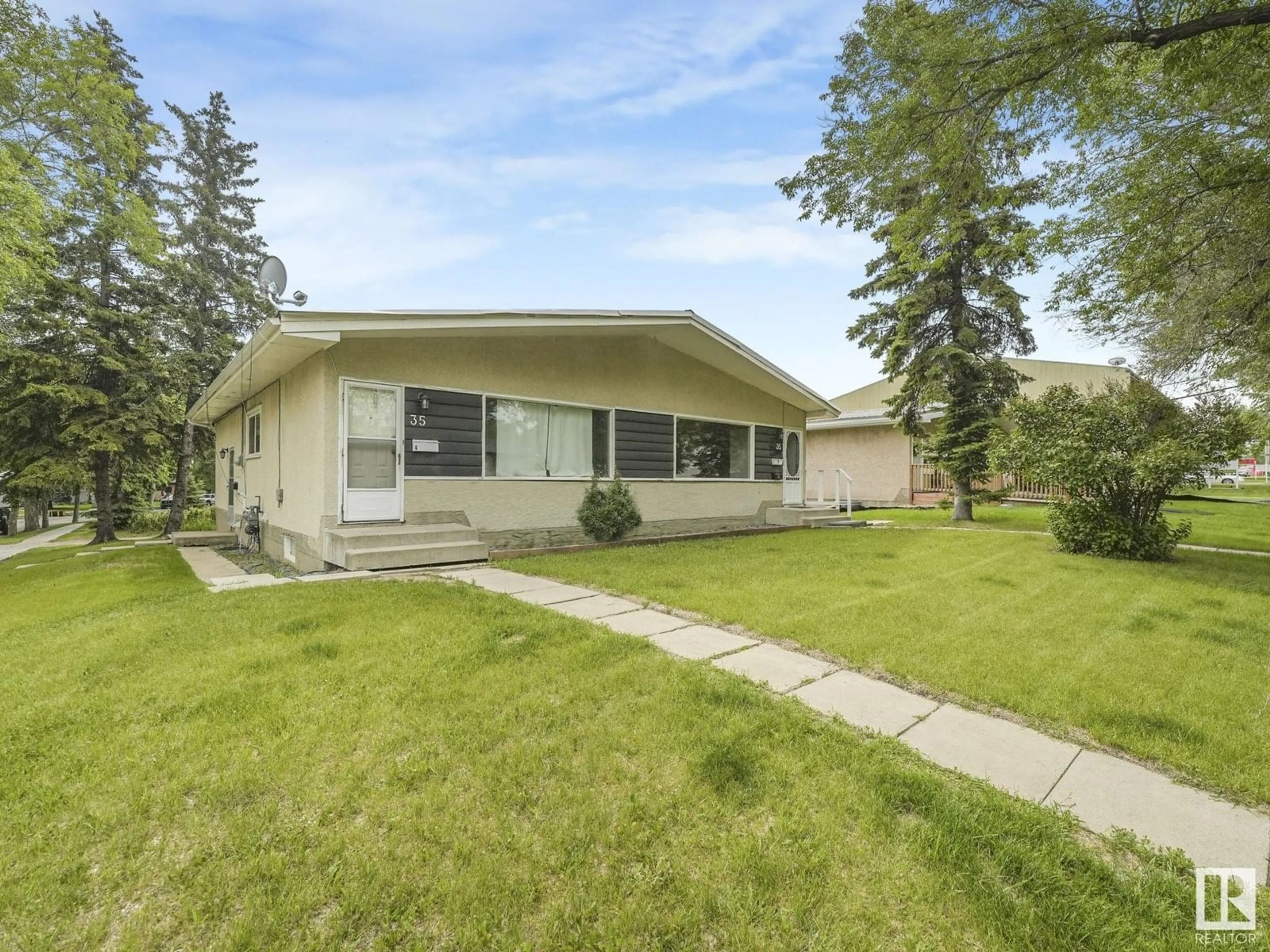 Home with vinyl exterior material, street for 35 GRAND DR, Camrose Alberta T4V2J9