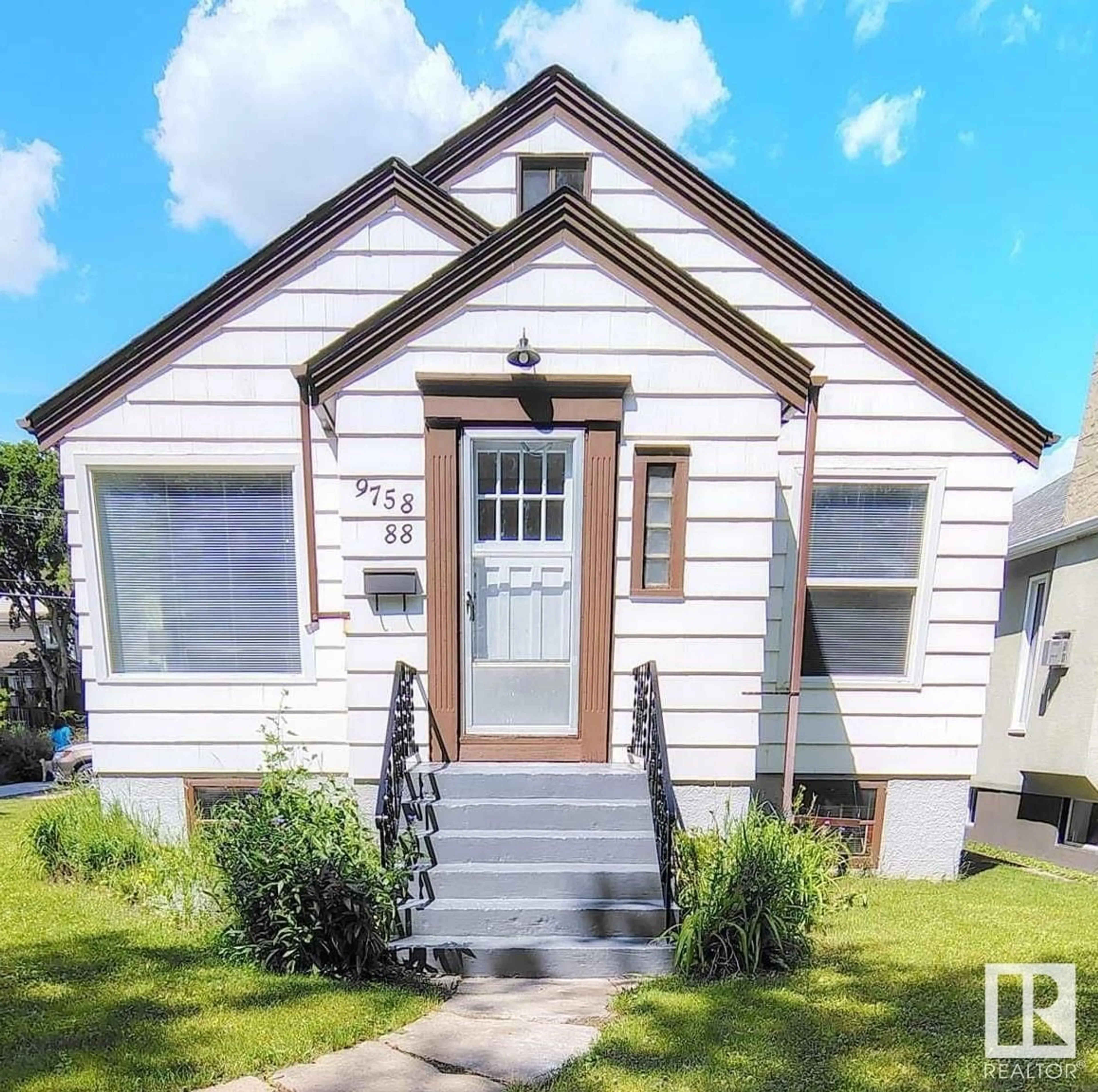 Home with vinyl exterior material, street for 9758 88 AV, Edmonton Alberta T6E2P9