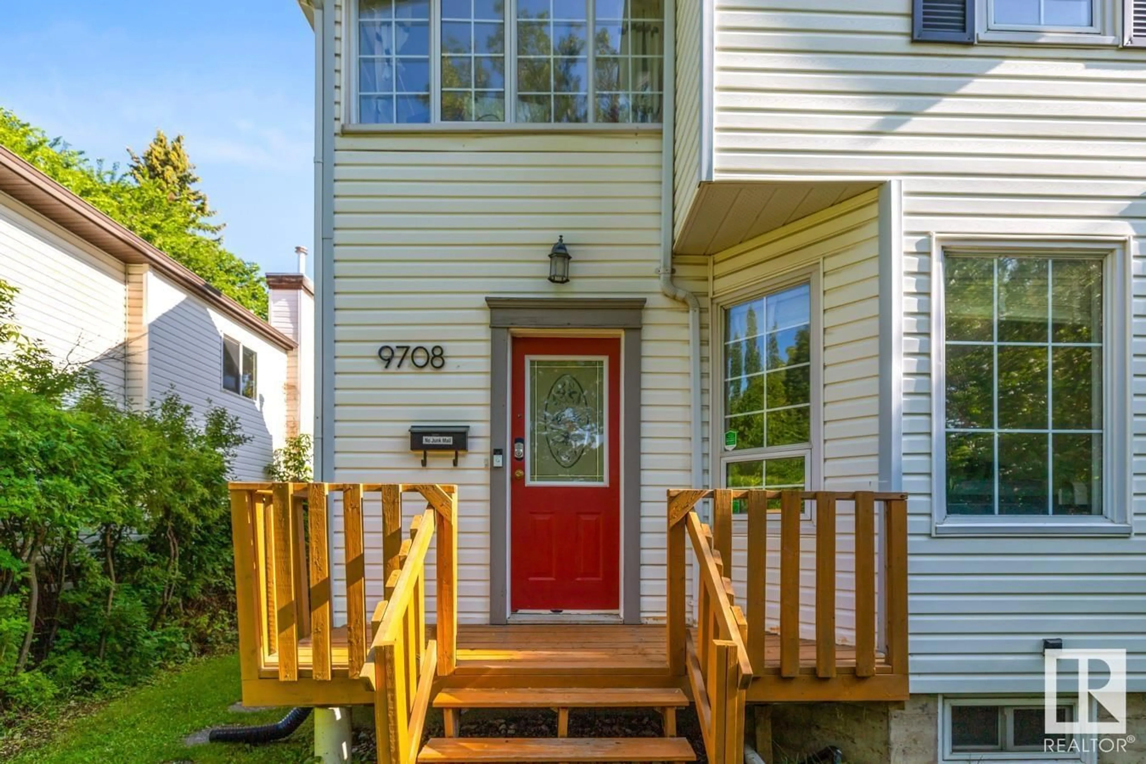 Home with vinyl exterior material, street for 9708 80 AV, Edmonton Alberta T6E1S7